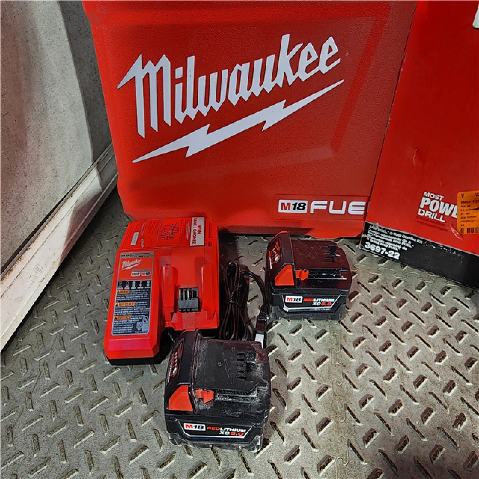 HOUSTON LOCATION - AS-IS Milwaukee M18 FUEL 18V Lithium-Ion Brushless Cordless Hammer Drill and Impact Driver Combo Kit (2-Tool) with 2 Batteries