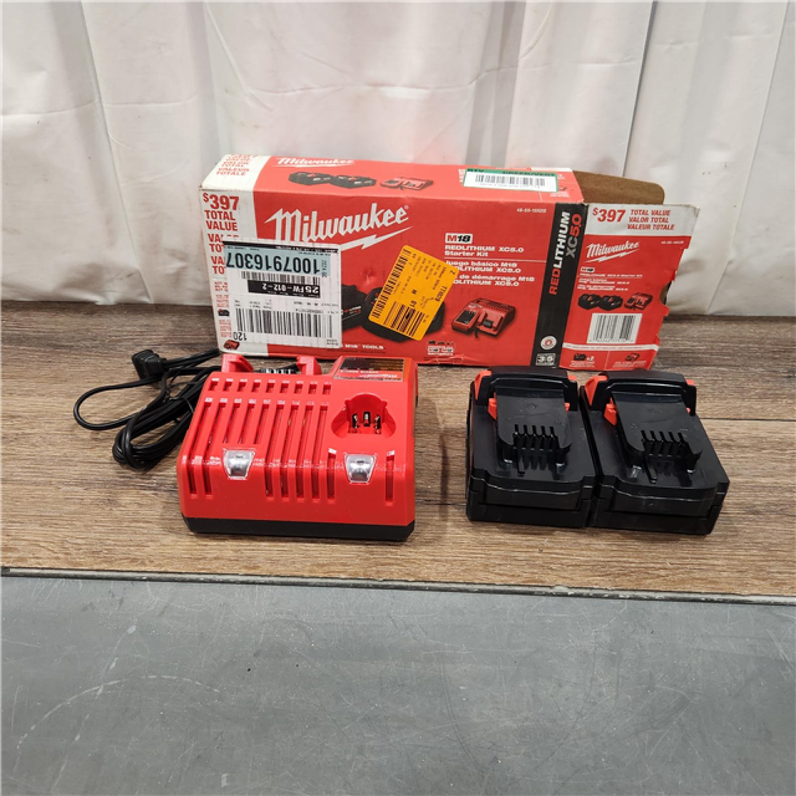 AS IS M18 18-Volt Lithium-Ion XC Starter Kit with Two 5.0Ah Batteries and Charger