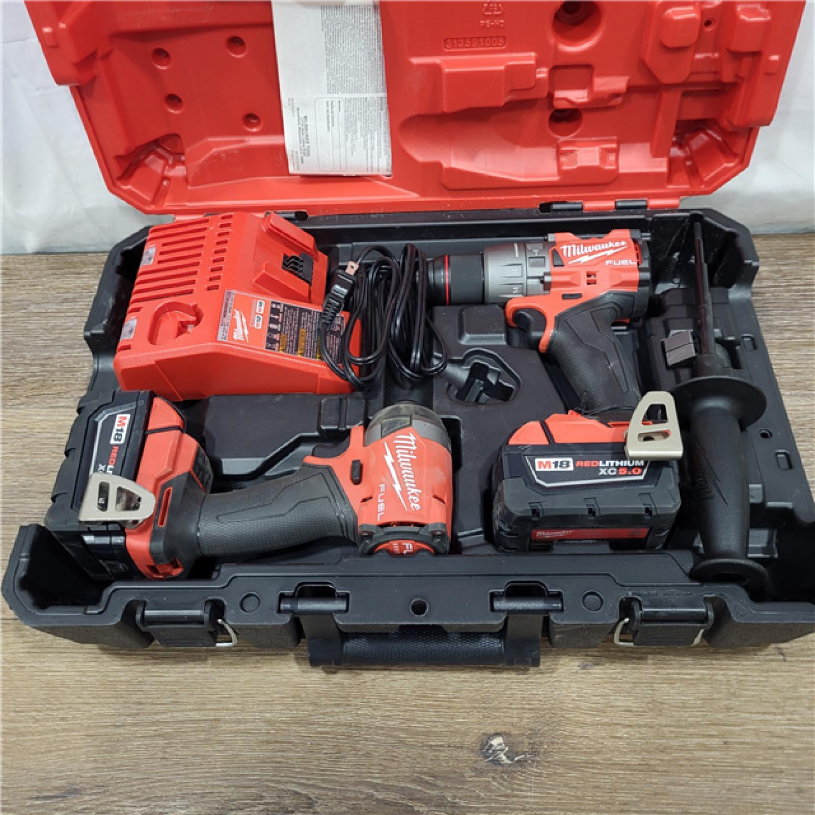 AS-IS Milwaukee M18 FUEL 18V Lithium-Ion Brushless Cordless Hammer Drill and Impact Driver Combo Kit (2-Tool) with 2 Batteries