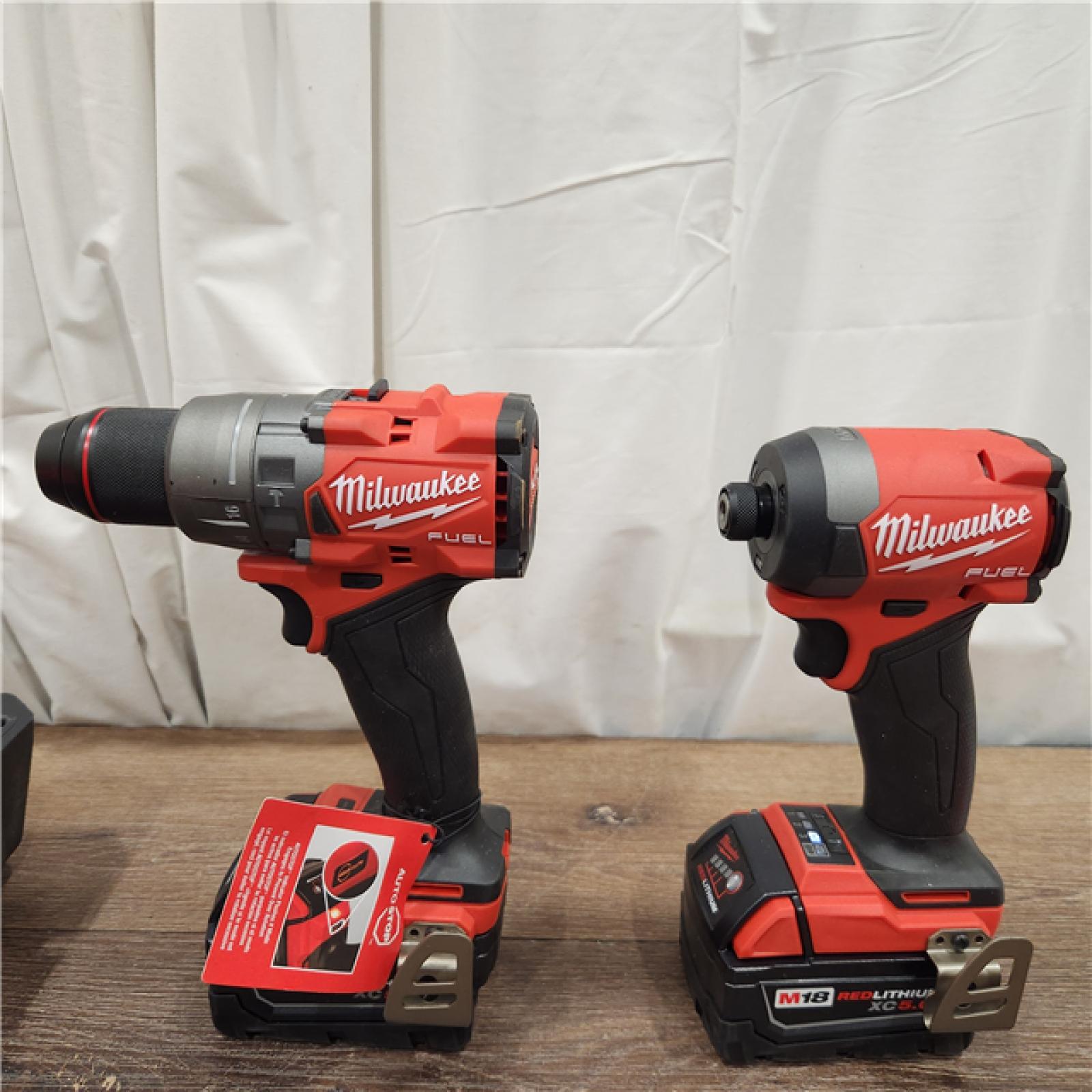 AS-IS Milwaukee M18 FUEL 18V Lithium-Ion Brushless Cordless Hammer Drill and Impact Driver Combo Kit (2-Tool) with 2 Batteries