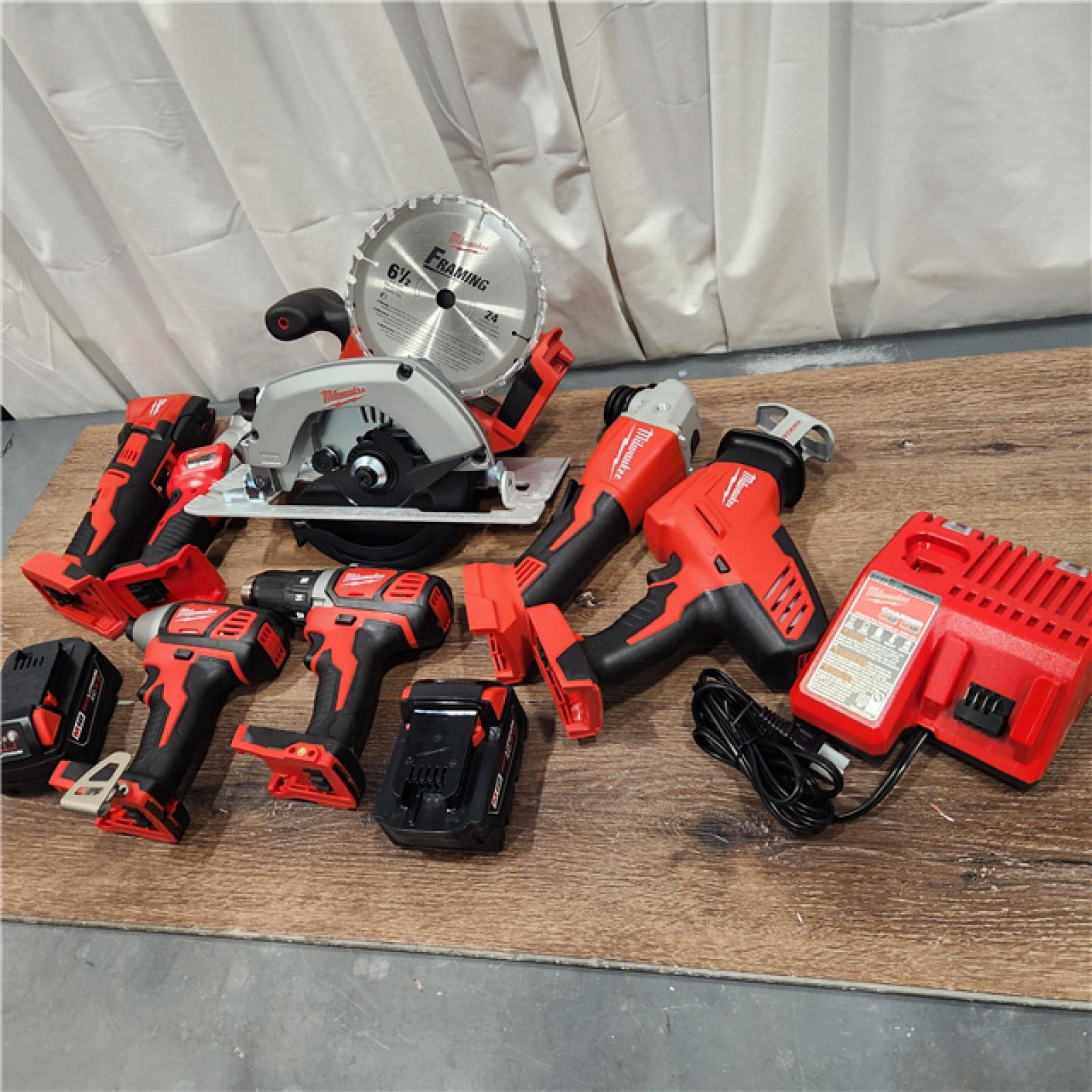 AS-IS Milwaukee M18 18-Volt Lithium-Ion Cordless Combo Kit 7-Tool with 2-Batteries, Charger and Tool Bag