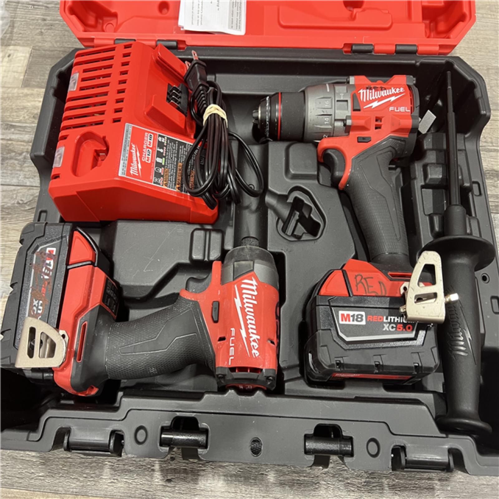 AS-IS MILWAUKEE M18 FUEL 18V Lithium-Ion Brushless Cordless Hammer Drill and Impact Driver Combo Kit (2-Tool) with 2 Batteries