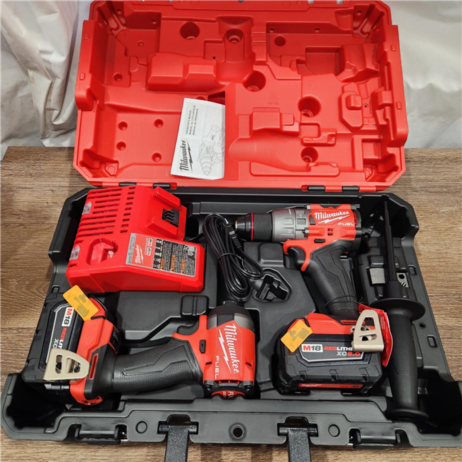 AS-IS Milwaukee M18 FUEL 18V Lithium-Ion Brushless Cordless Hammer Drill and Impact Driver Combo Kit (2-Tool) with 2 Batteries