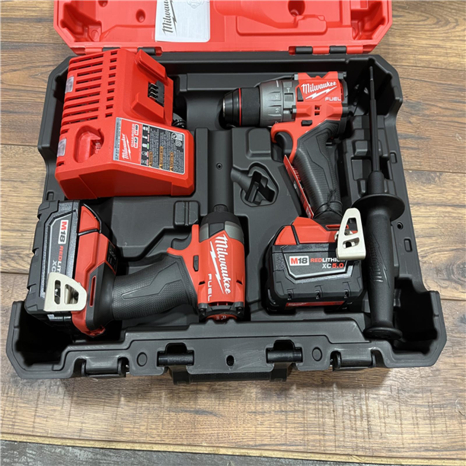 AS-IS Milwaukee M18 FUEL 18V Lithium-Ion Brushless Cordless Hammer Drill and Impact Driver Combo Kit (2-Tool) with 2 Batteries