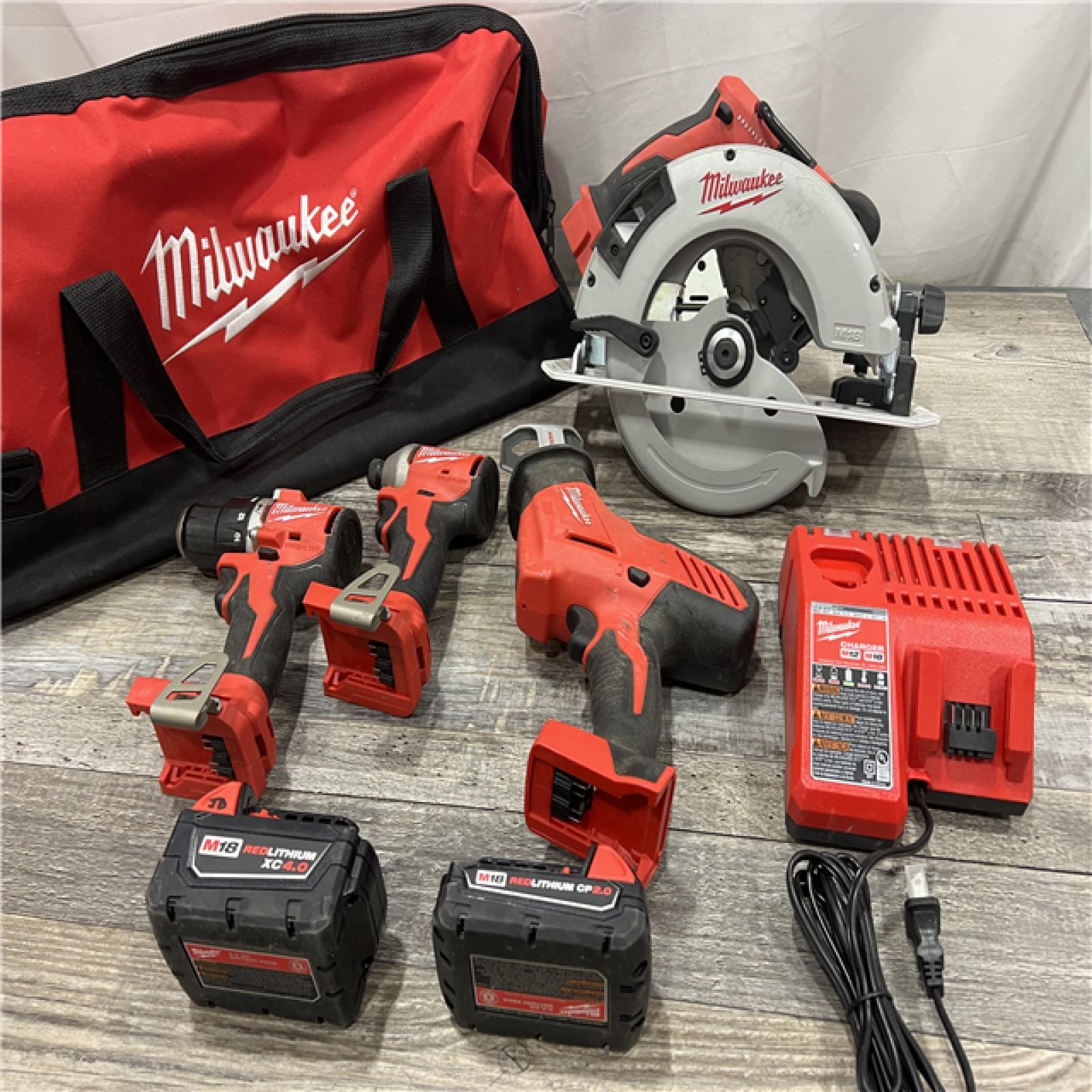 AS-IS Milwaukee M18 18-Volt Lithium-Ion Brushless Cordless Combo Kit (4-Tool) with 2-Batteries, 1-Charger and Tool Bag