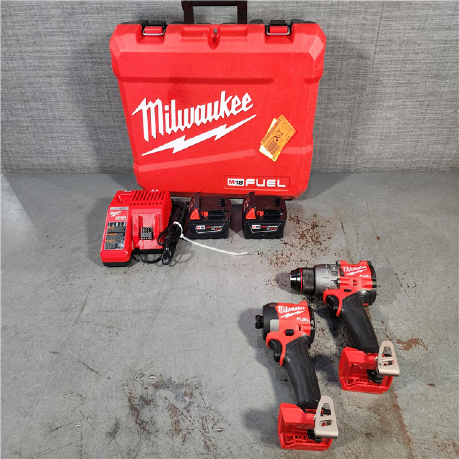 HOUSTON LOCATION - AS-IS Milwaukee M18 FUEL 18V Lithium-Ion Brushless Cordless Hammer Drill and Impact Driver Combo Kit (2-Tool) with 2 Batteries