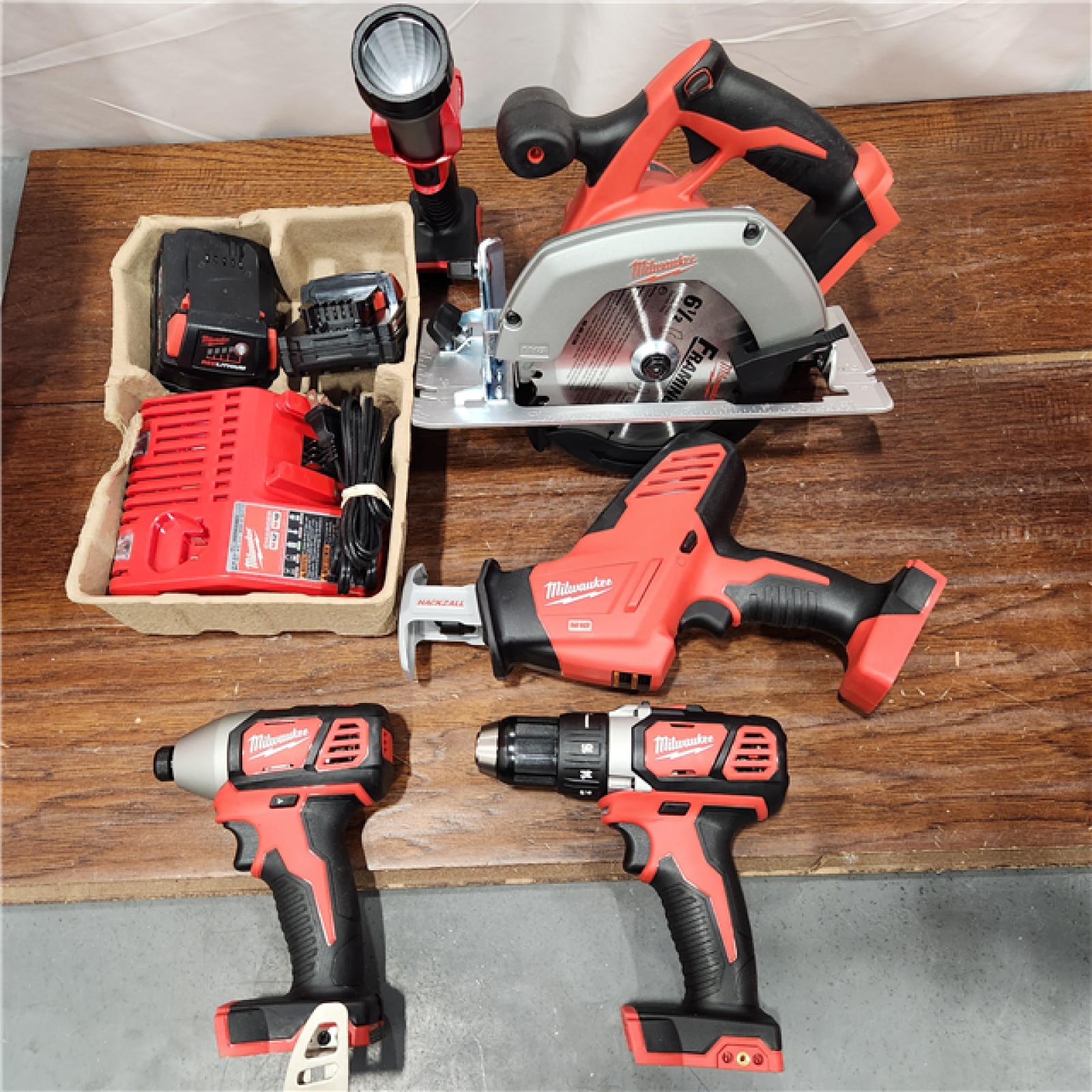 AS-IS Milwaukee M18 18-Volt Lithium-Ion Cordless Combo Tool Kit (5-Tool) with (1) 3.0Ah and (1) 1.5Ah Battery, (1) Charger, (1) Tool Bag