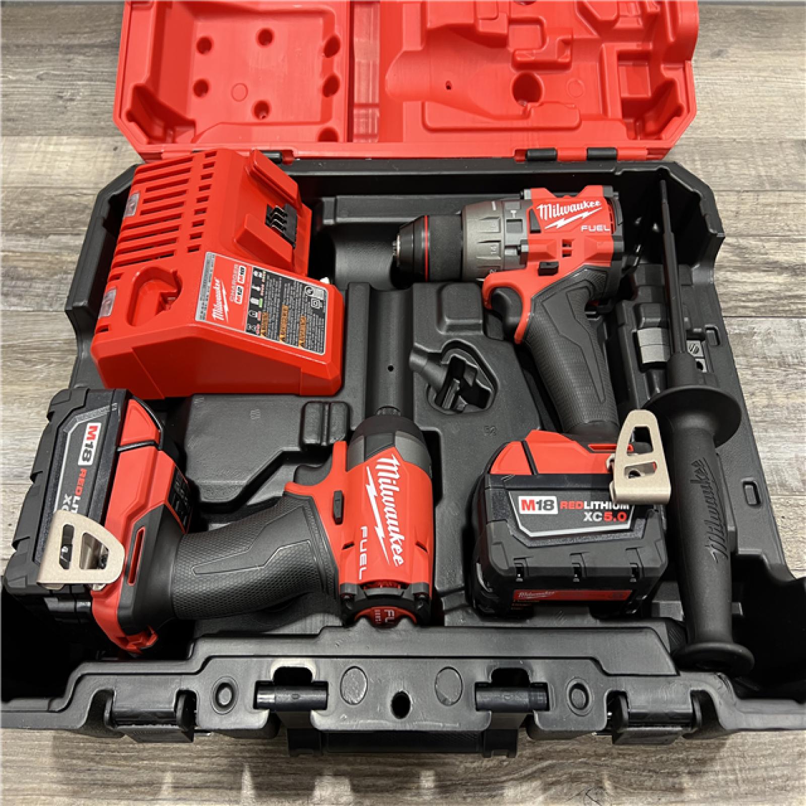 AS-IS Milwaukee M18 FUEL 18V Lithium-Ion Brushless Cordless Hammer Drill and Impact Driver Combo Kit (2-Tool) with 2 Batteries