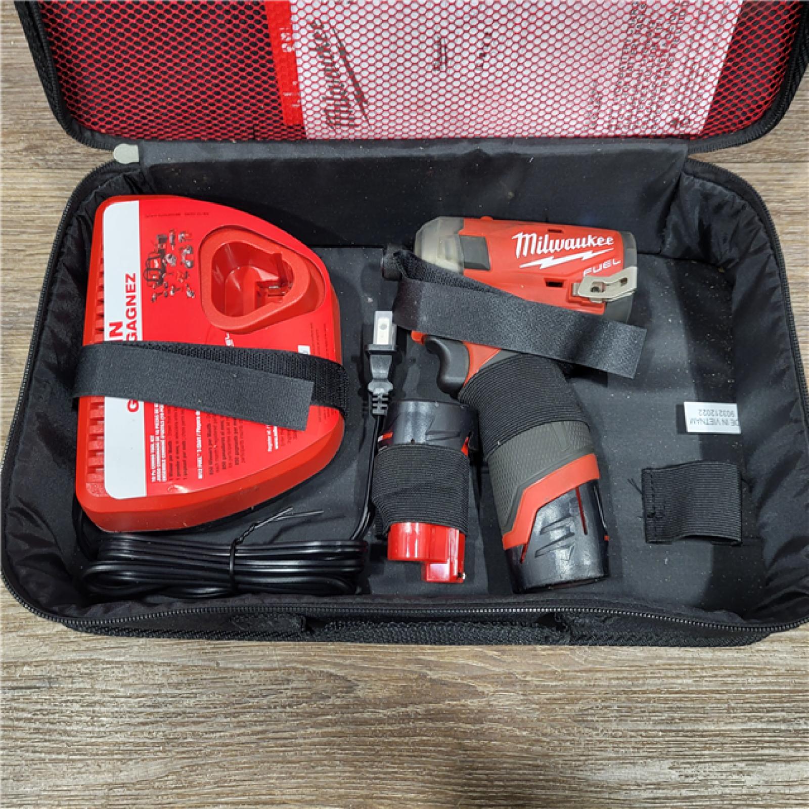 AS-IS M12 FUEL SURGE 12V Lithium-Ion Brushless Cordless 1/4 in. Hex Impact Driver Compact Kit W/Two 2.0Ah Batteries, Bag