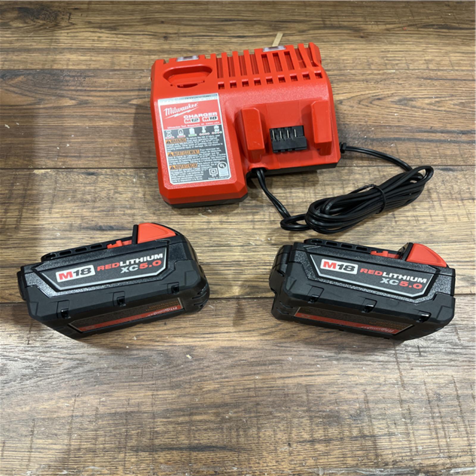 AS-IS Milwaukee M18 18-Volt Lithium-Ion XC Starter Kit with Two 5.0Ah Batteries / Charger (48-59-1852B)