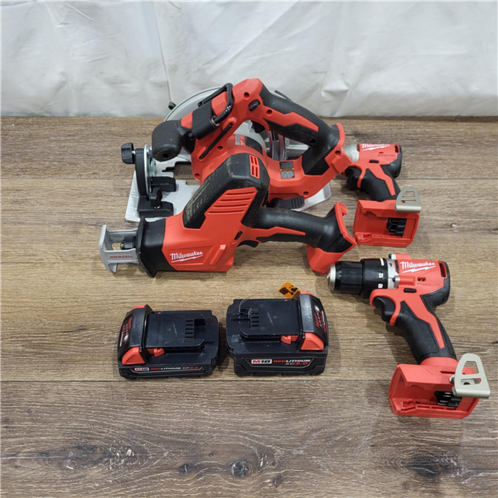 AS-IS M18 18-Volt Lithium-Ion Brushless Cordless Combo Kit (4-Tool) with 2-Batteries, 1-Charger and Tool Bag