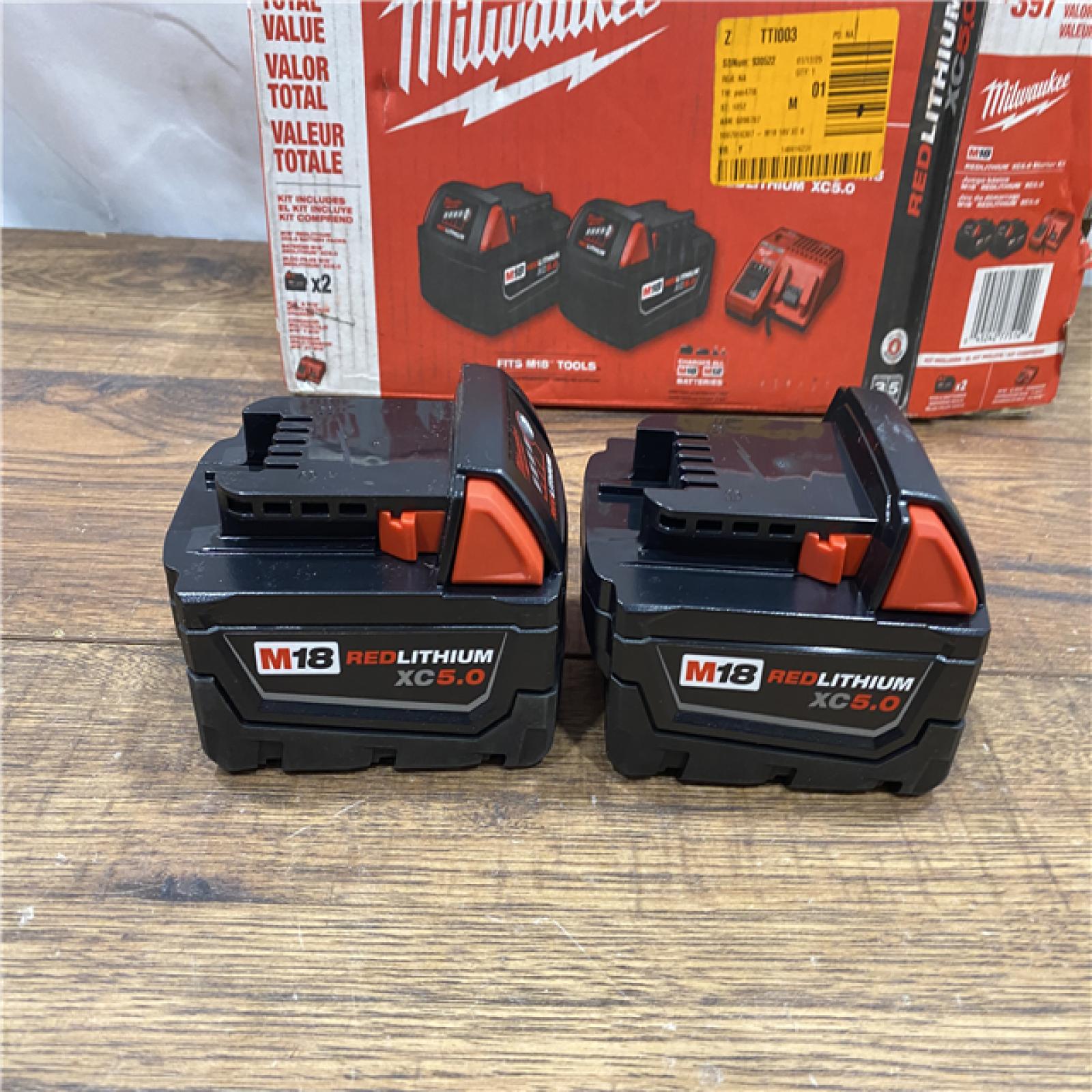 AS IS Milwaukee M18 18-Volt Lithium-Ion XC Starter Kit with Two 5.0Ah Batteries / Charger (48-59-1852B)