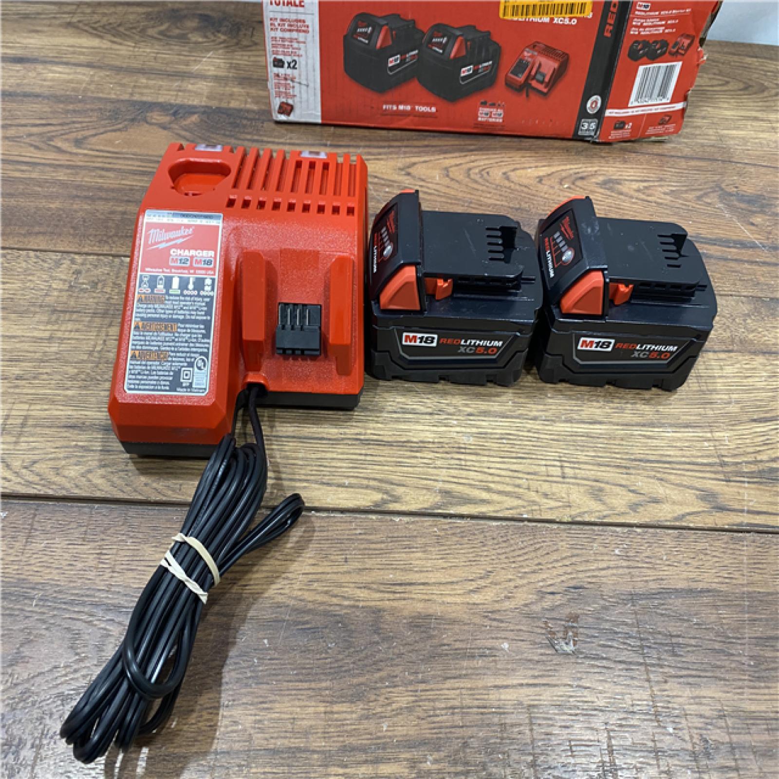 AS IS Milwaukee M18 18-Volt Lithium-Ion XC Starter Kit with Two 5.0Ah Batteries / Charger (48-59-1852B)