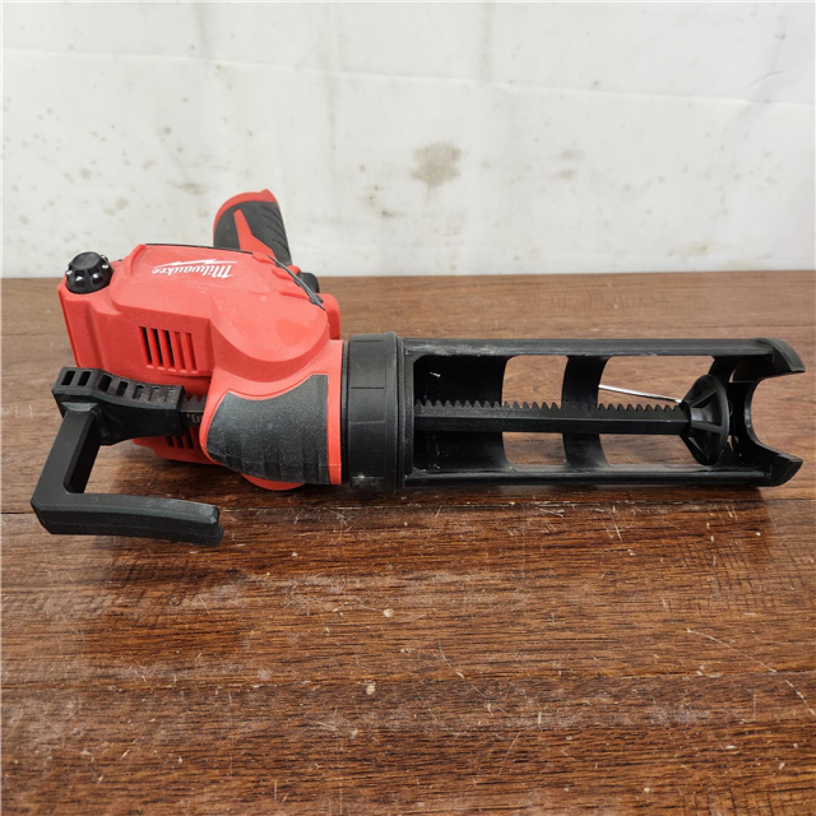 AS-IS Milwaukee M12 Cordless 10 oz. Caulk and Adhesive Gun (Tool-Only)