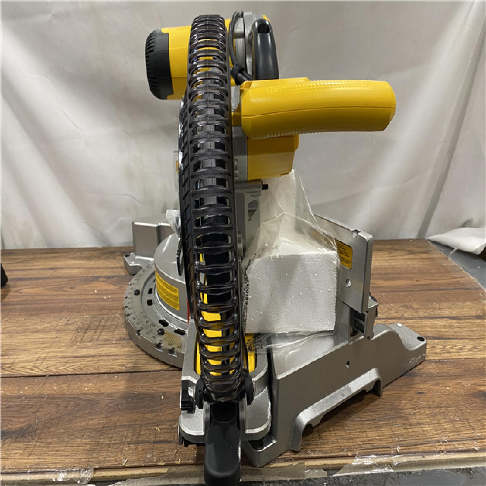 AS IS DEWALT 15 Amp Corded 12 in. Double Bevel Sliding Compound Miter Saw, Blade Wrench and Material Clamp