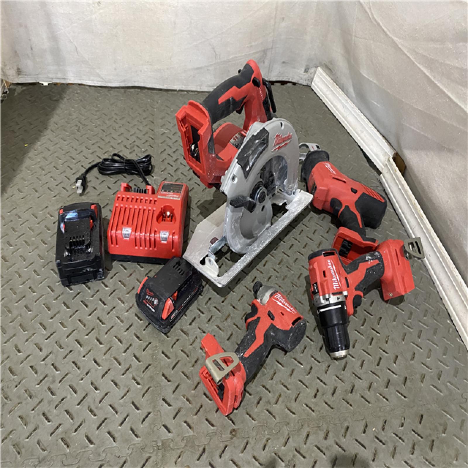 Houston location AS-IS MILWAUKEE M18 18-Volt Lithium-Ion Brushless Cordless Combo Kit (4-Tool) with 2-Batteries, 1-Charger and Tool Bag