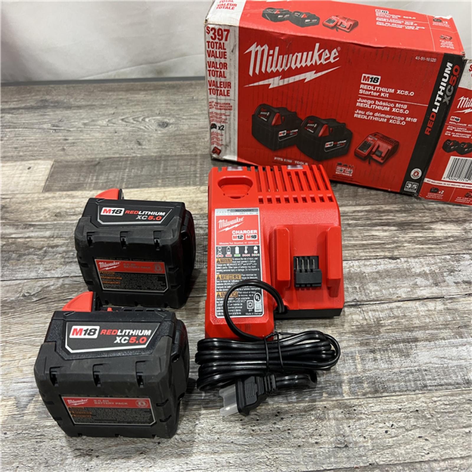 AS-IS MILWAUKEE M18 18-Volt Lithium-Ion XC Starter Kit with Two 5.0Ah Batteries and Charger