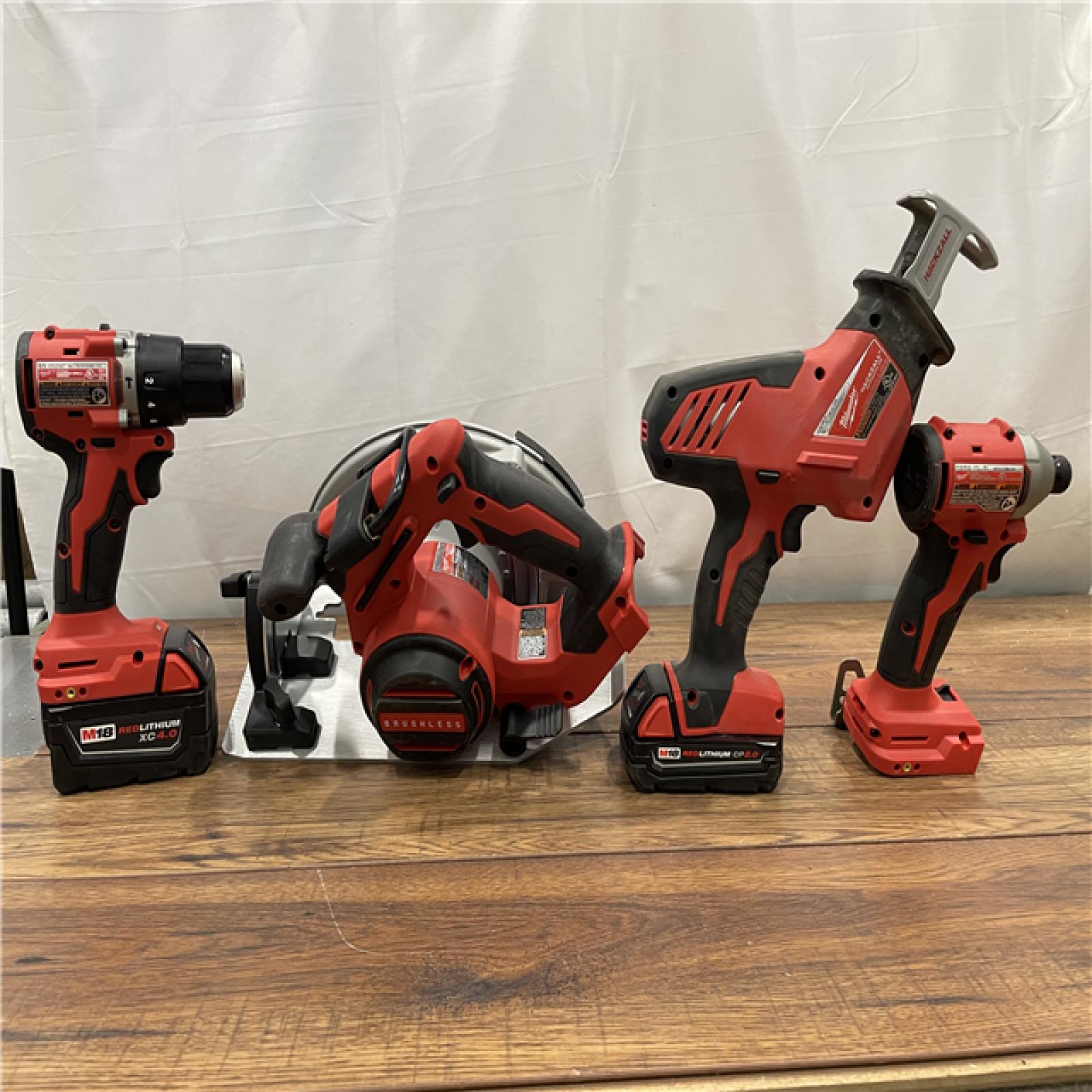 AS-IS MILWAUKEE  M18 18-Volt Lithium-Ion Brushless Cordless Combo Kit (4-Tool)