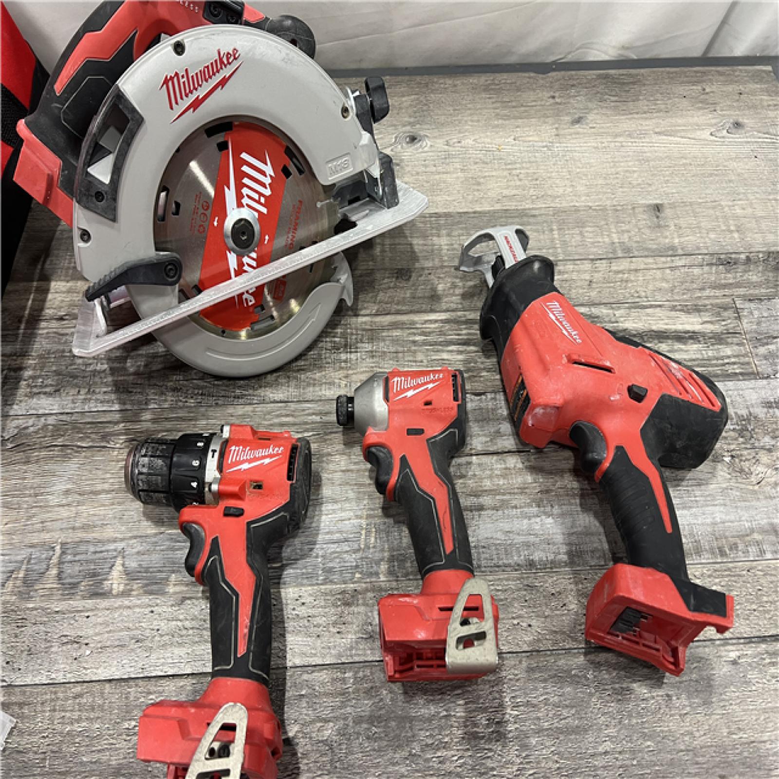 AS-IS MILWAUKEE M18 18-Volt Lithium-Ion Brushless Cordless Combo Kit (4-Tool) with 2-Batteries, 1-Charger and Tool Bag