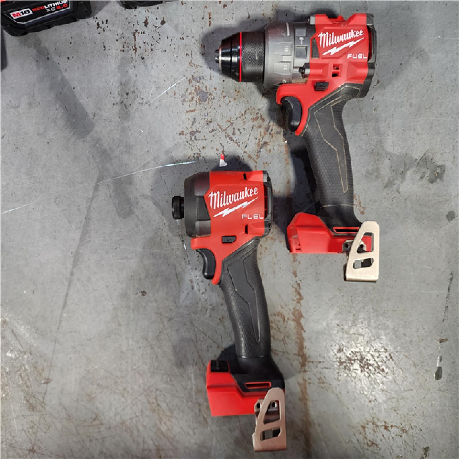 HOUSTON LOCATION - AS-IS Milwaukee M18 FUEL 18V Lithium-Ion Brushless Cordless Hammer Drill and Impact Driver Combo Kit (2-Tool) with 2 Batteries