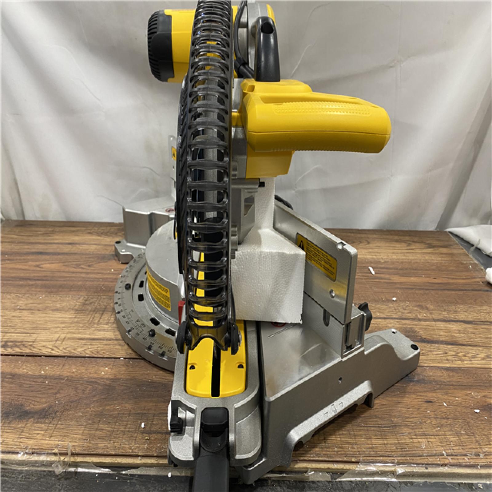 AS IS DEWALT 15 Amp Corded 12 in. Double Bevel Sliding Compound Miter Saw, Blade Wrench and Material Clamp