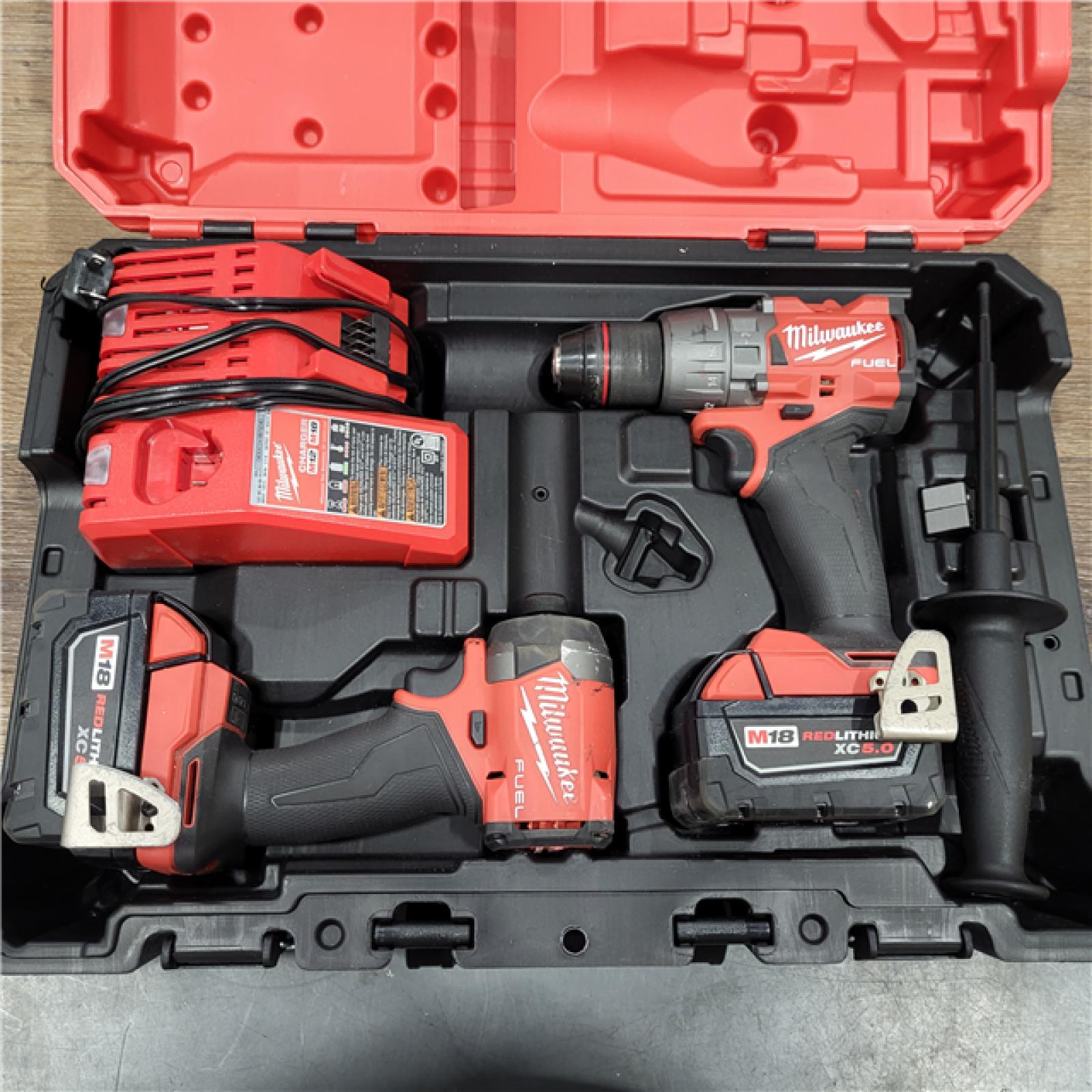 AS-IS Milwaukee M18 FUEL 18V Lithium-Ion Brushless Cordless Hammer Drill and Impact Driver Combo Kit (2-Tool) with 2 Batteries