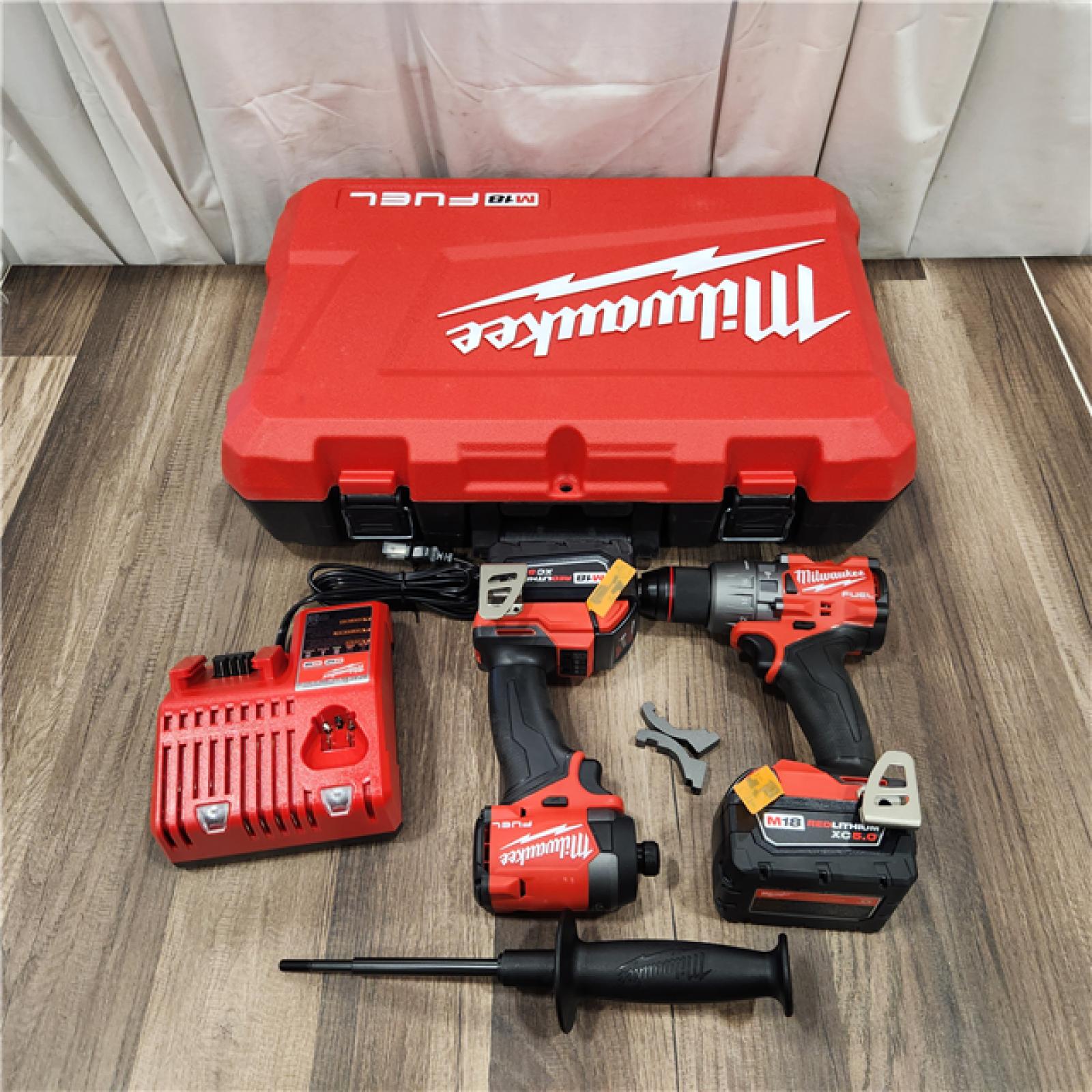 AS IS Milwaukee M18 FUEL 18V Lithium-Ion Brushless Cordless Hammer Drill and Impact Driver Combo Kit (2-Tool) with 2 Batteries