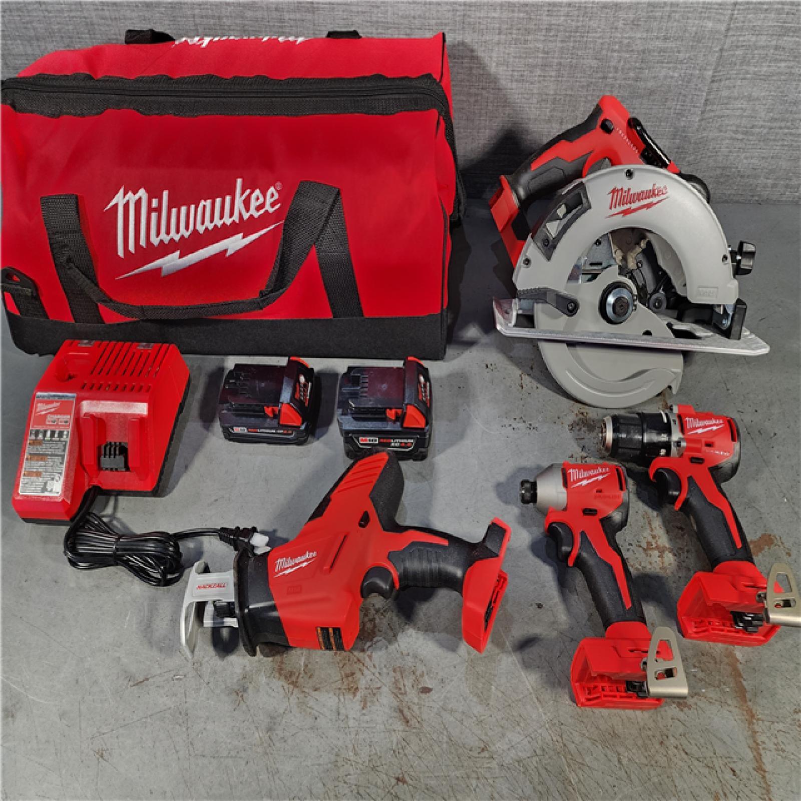 HOUSTON LOCATION - AS-IS Milwaukee M18 18-Volt Lithium-Ion Brushless Cordless Combo Kit (4-Tool) with 2-Batteries, 1-Charger and Tool Bag