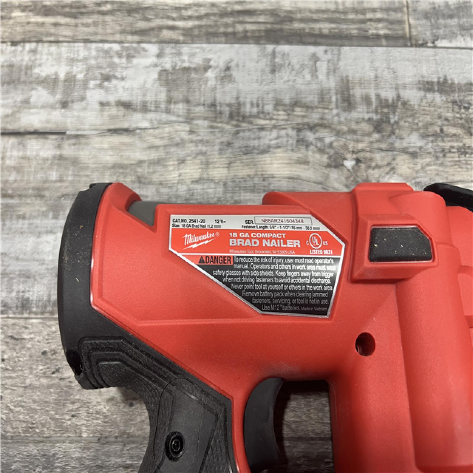 AS-IS MILWAUKEE M12 FUEL 12-Volt Lithium-Ion Brushless Cordless 18-Guage Compact Brad Nailer (Tool Only)