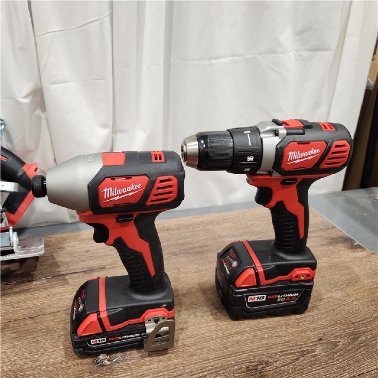 AS-IS Milwaukee M18 18-Volt Lithium-Ion Cordless Combo Tool Kit (5-Tool) with (1) 3.0Ah and (1) 1.5Ah Battery, (1) Charger, (1) Tool Bag