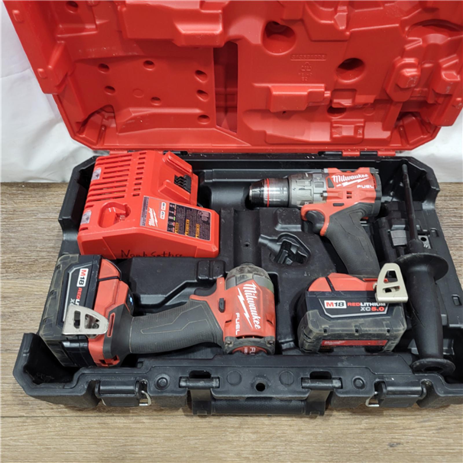 AS-IS Milwaukee M18 FUEL 18V Lithium-Ion Brushless Cordless Hammer Drill and Impact Driver Combo Kit (2-Tool) with 2 Batteries