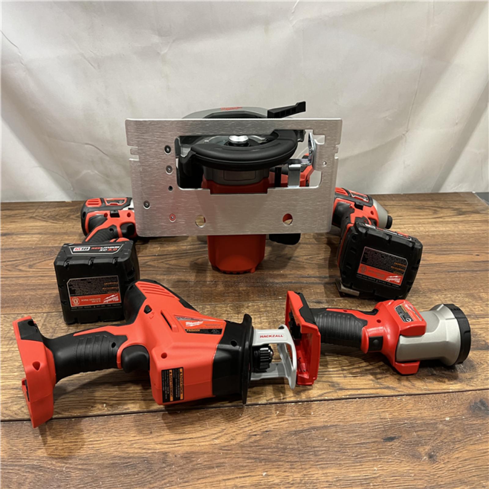 AS IS Milwaukee M18 18-Volt Lithium-Ion Cordless Combo Tool Kit (5-Tool) with (1) 3.0Ah and (1) 1.5Ah Battery, (1) Charger, (1) Tool Bag