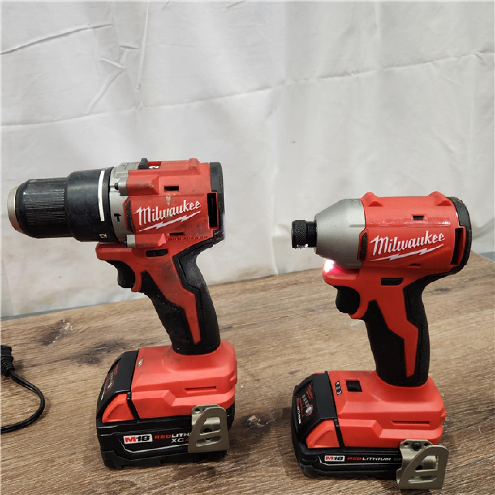 AS-IS M18 18-Volt Lithium-Ion Brushless Cordless Compact Hammer Drill/Impact Combo Kit (2-Tool) with (2) Batteries, Bag