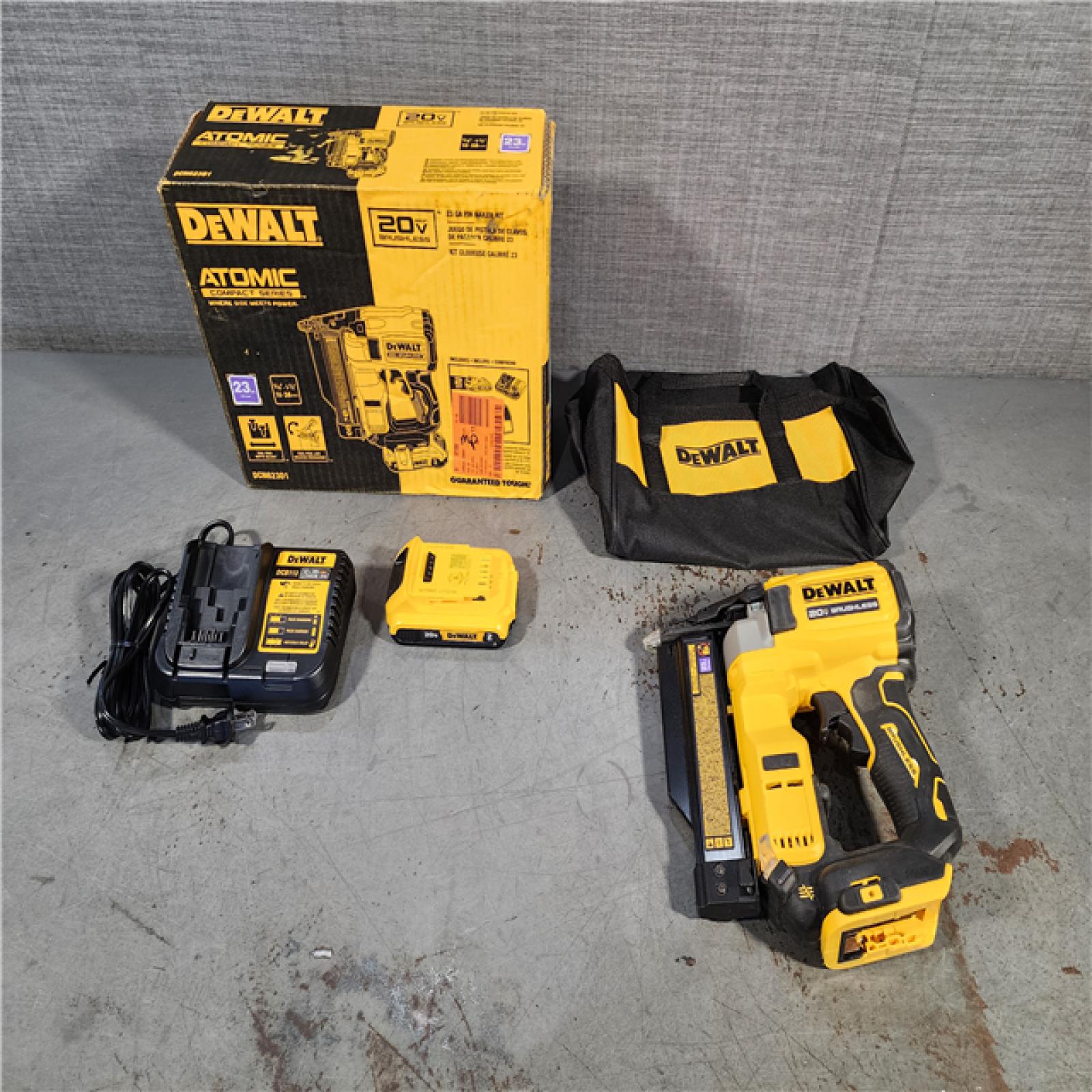 HOUSTON LOCATION - AS-IS DEWALT ATOMIC 20V MAX Lithium Ion Cordless 23 Gauge Pin Nailer Kit with 2.0Ah Battery and Charger