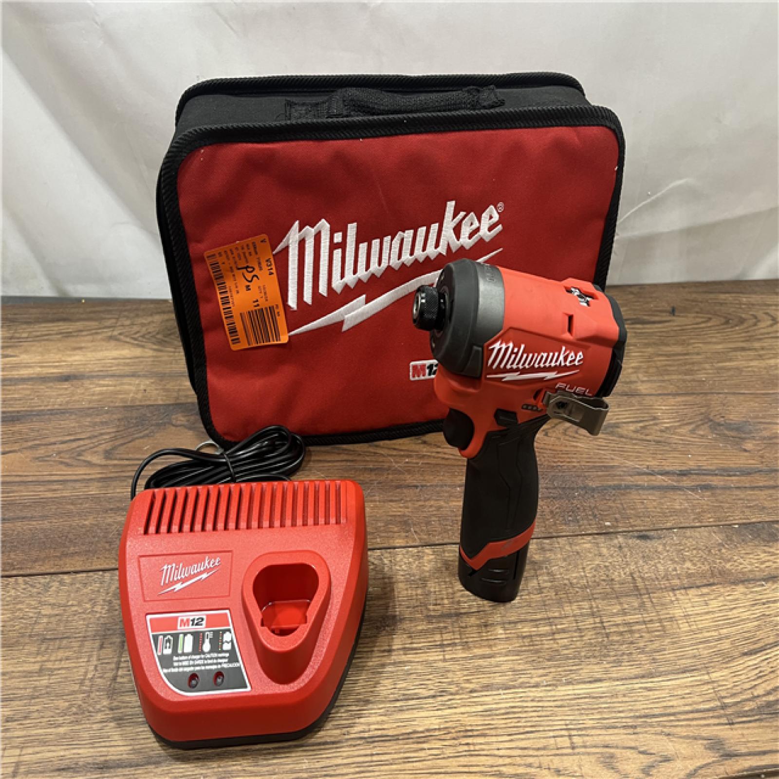 AS IS Milwaukee M12 FUEL 12 V 1/4 in. Cordless Brushless Impact Driver (Tool KIT battery & charge)