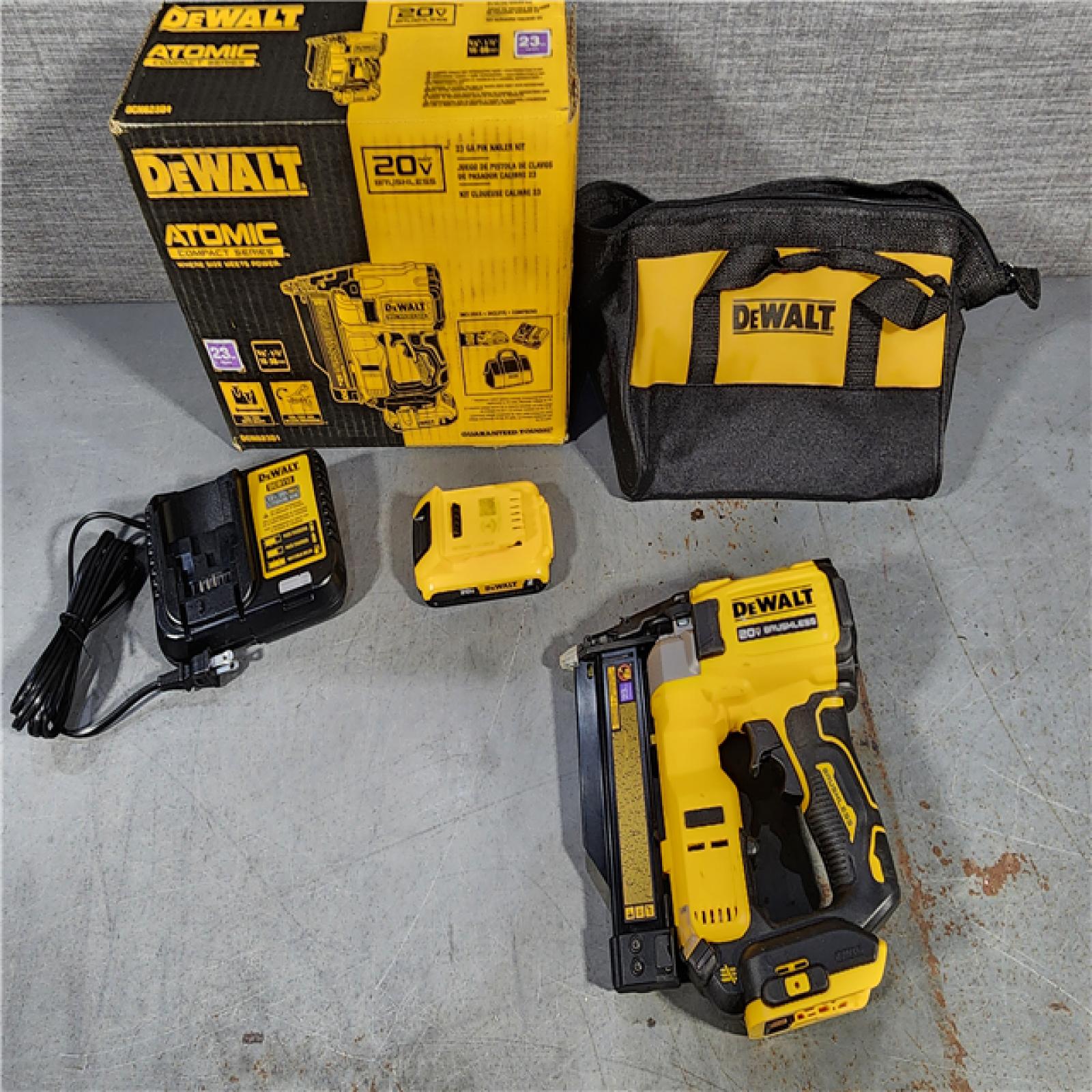 HOUSTON LOCATION - AS-IS DEWALT ATOMIC 20V MAX Lithium Ion Cordless 23 Gauge Pin Nailer Kit with 2.0Ah Battery and Charger