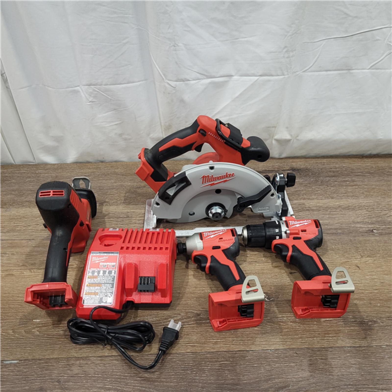 AS-IS Milwaukee M18 18-Volt Lithium-Ion Brushless Cordless Combo Kit (4-Tool) with 2-Batteries, 1-Charger and Tool Bag