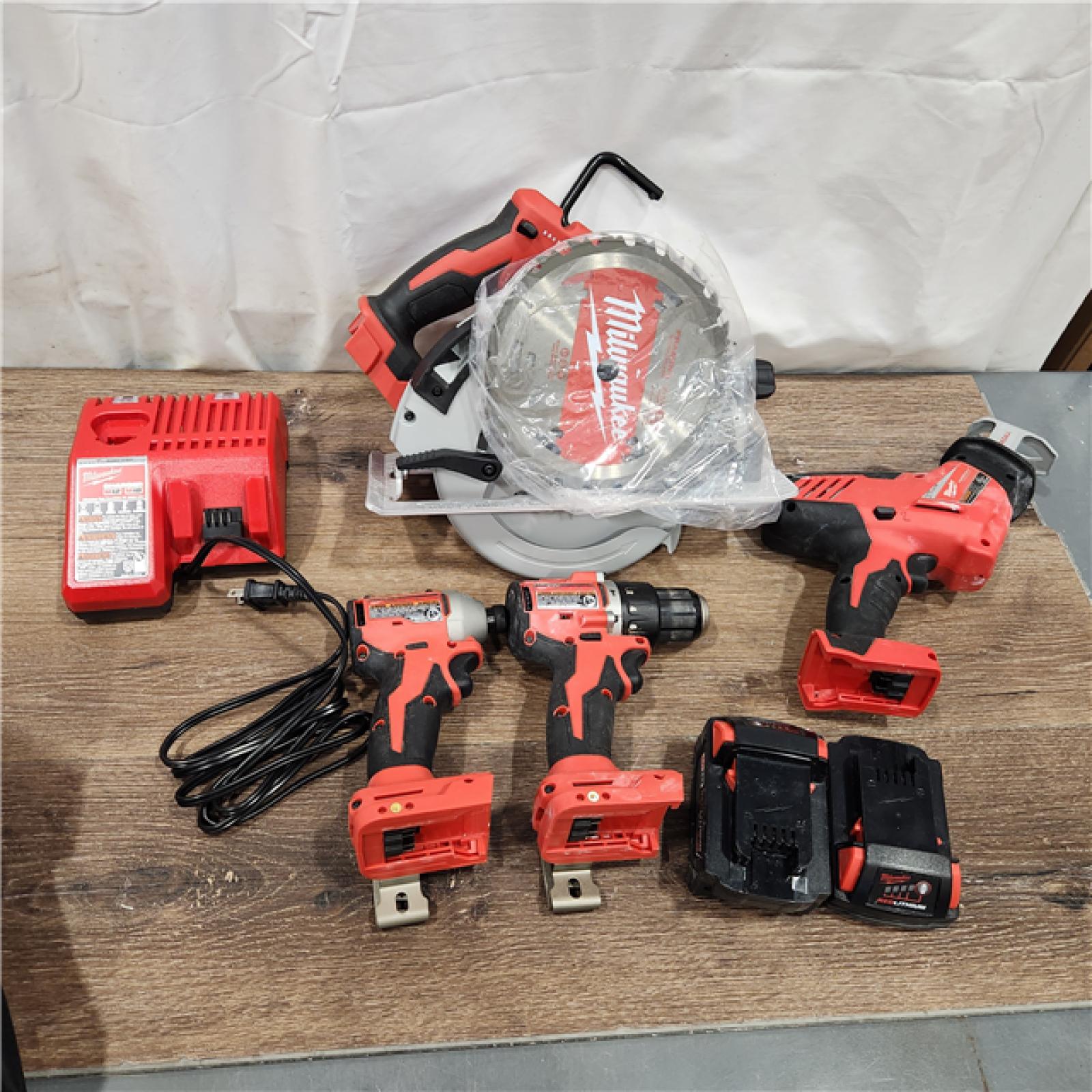 AS-IS Milwaukee M18 18-Volt Lithium-Ion Brushless Cordless Combo Kit (4-Tool) with 2-Batteries, 1-Charger and Tool Bag