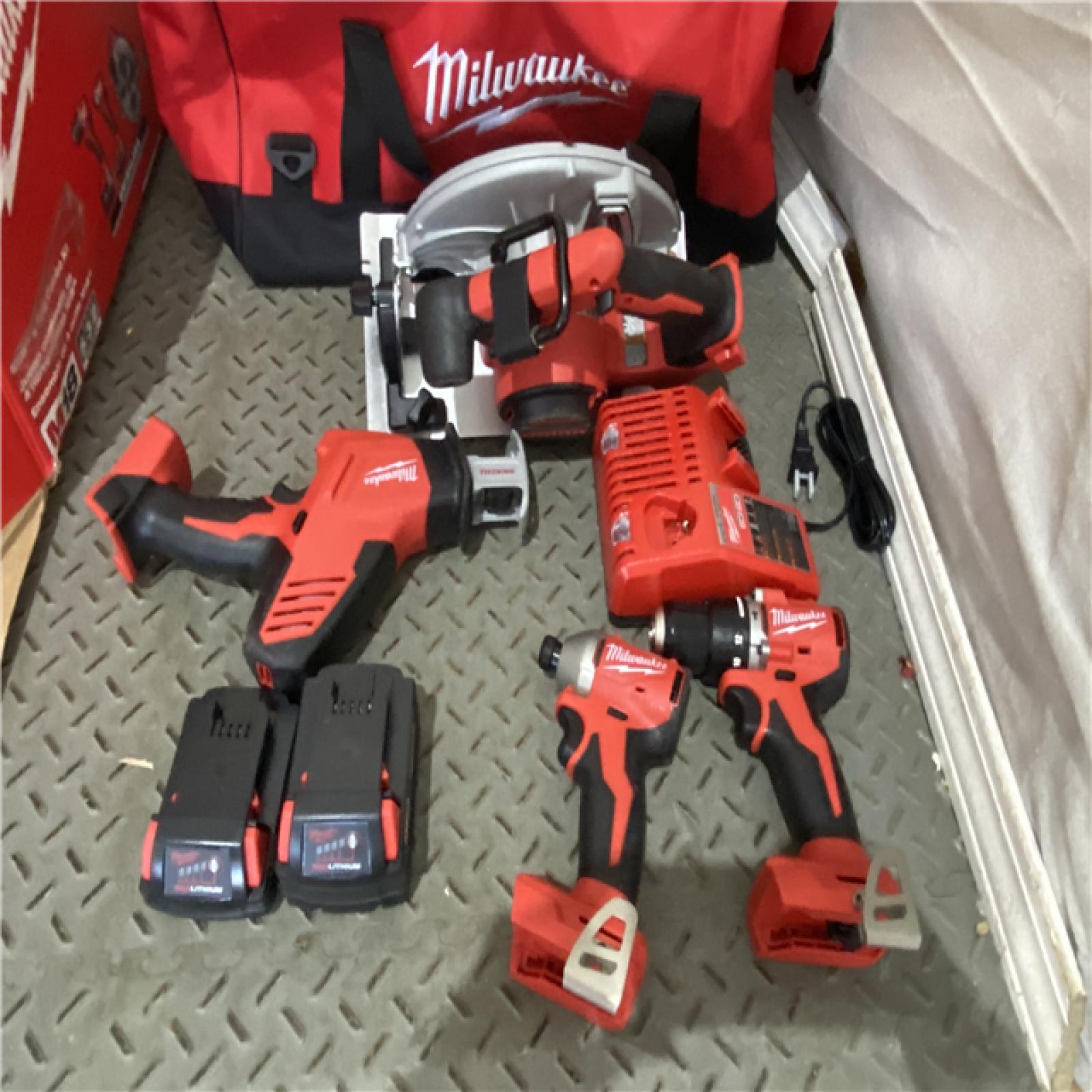 Houston location AS-IS MILWUAKEE M18 18-Volt Lithium-Ion Brushless Cordless Combo Kit (4-Tool) with 2-Batteries, 1-Charger and Tool Bag