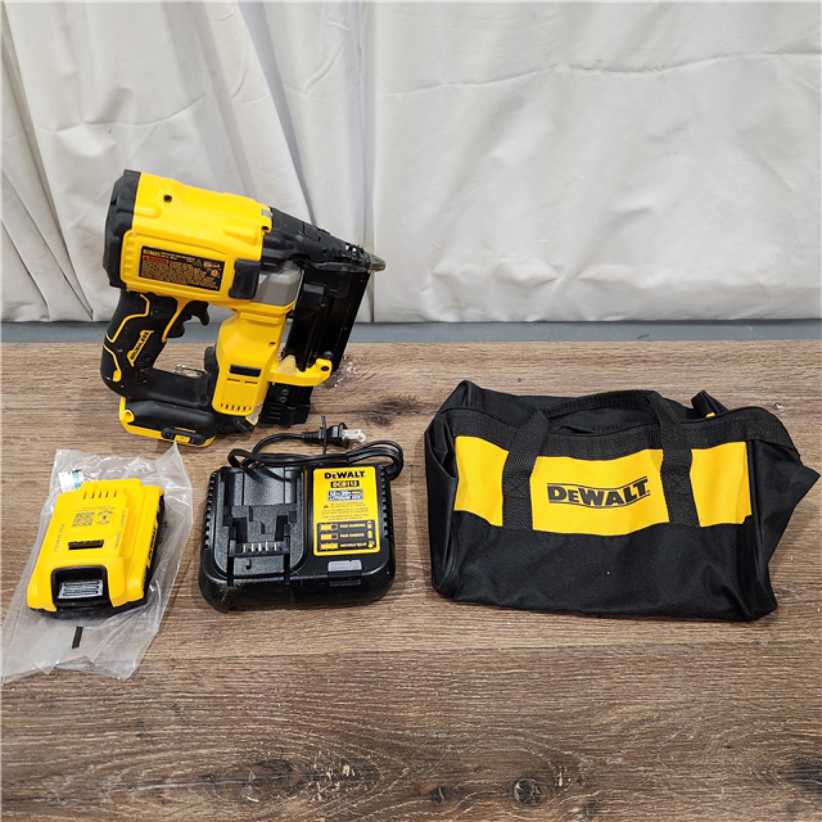 AS-IS DEWALT ATOMIC 20V MAX Lithium Ion Cordless 23 Gauge Pin Nailer Kit with 3.0Ah Battery and Charger