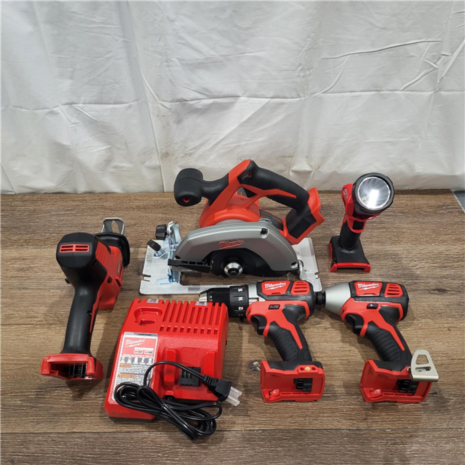 AS-IS Milwaukee M18 18-Volt Lithium-Ion Cordless Combo Tool Kit (5-Tool) with (1) 3.0Ah and (1) 1.5Ah Battery, (1) Charger, (1) Tool Bag