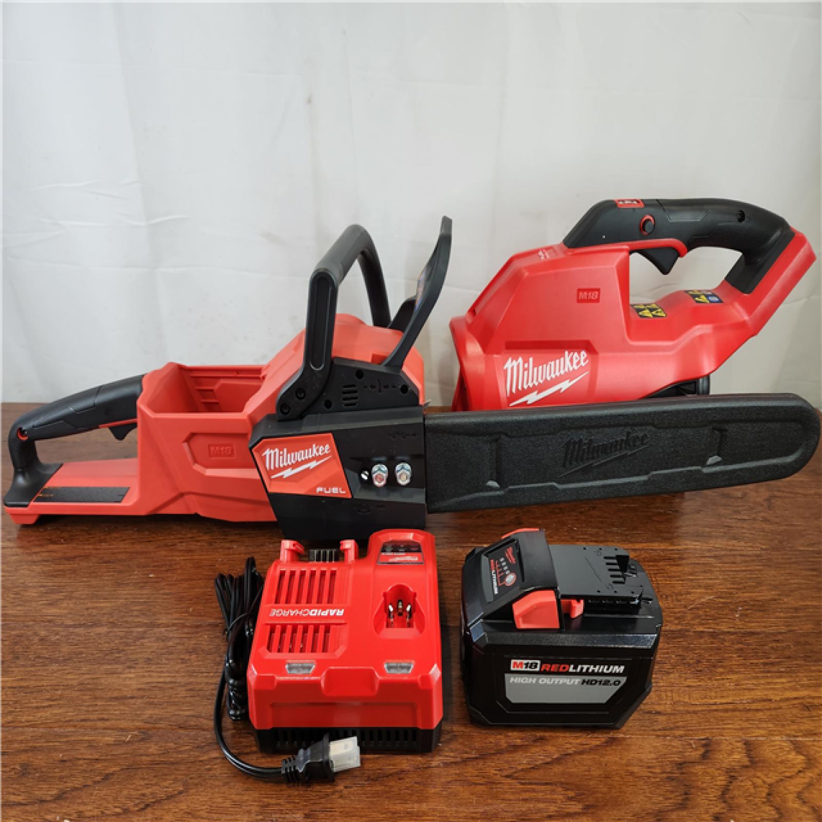 Like-New Milwaukee M18 FUEL 18V Brushless Cordless 16 in. Chainsaw Kit w/ M18 GEN II FUEL Blower