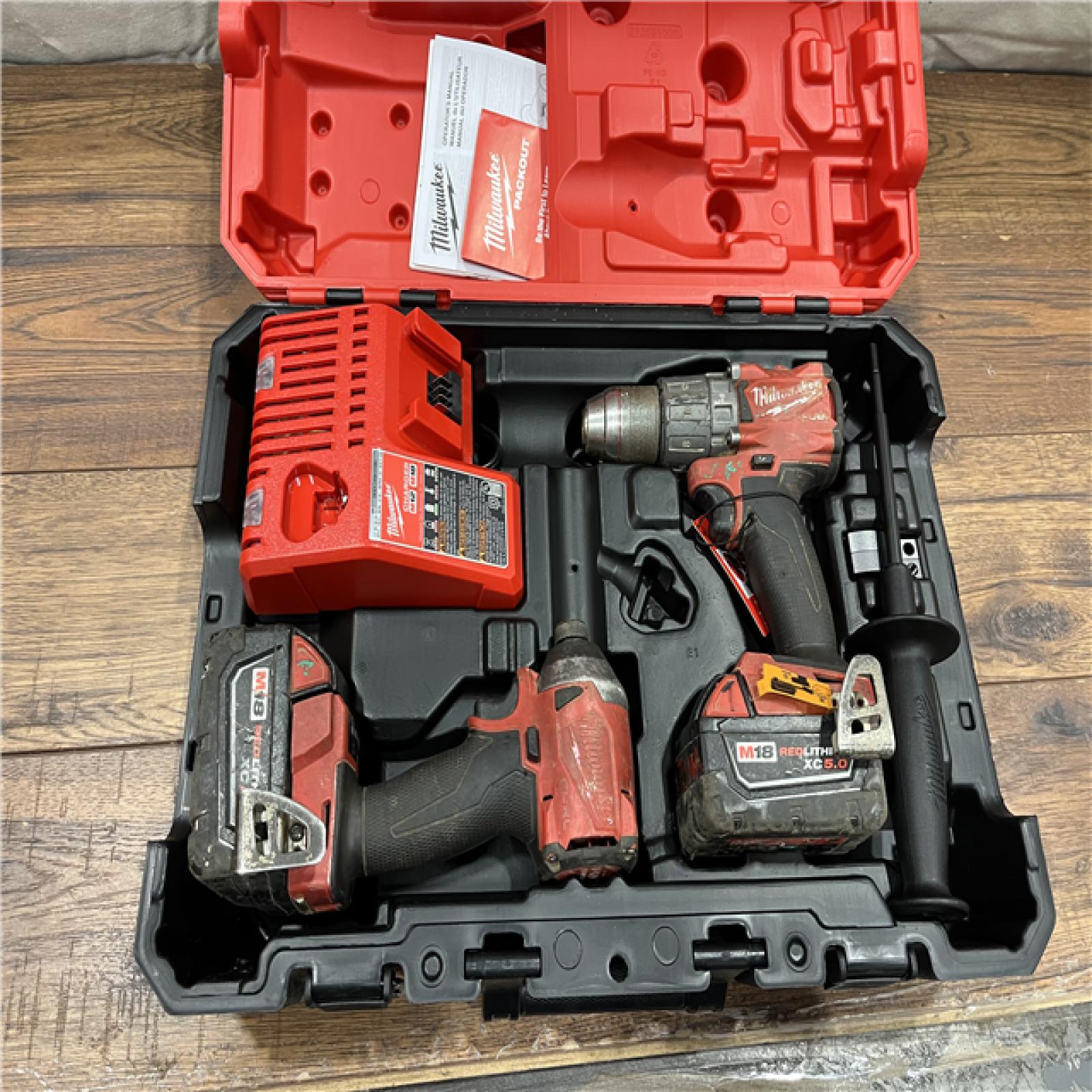 AS-IS Milwaukee M18 FUEL 18V Lithium-Ion Brushless Cordless Hammer Drill and Impact Driver Combo Kit (2-Tool) with 2 Batteries