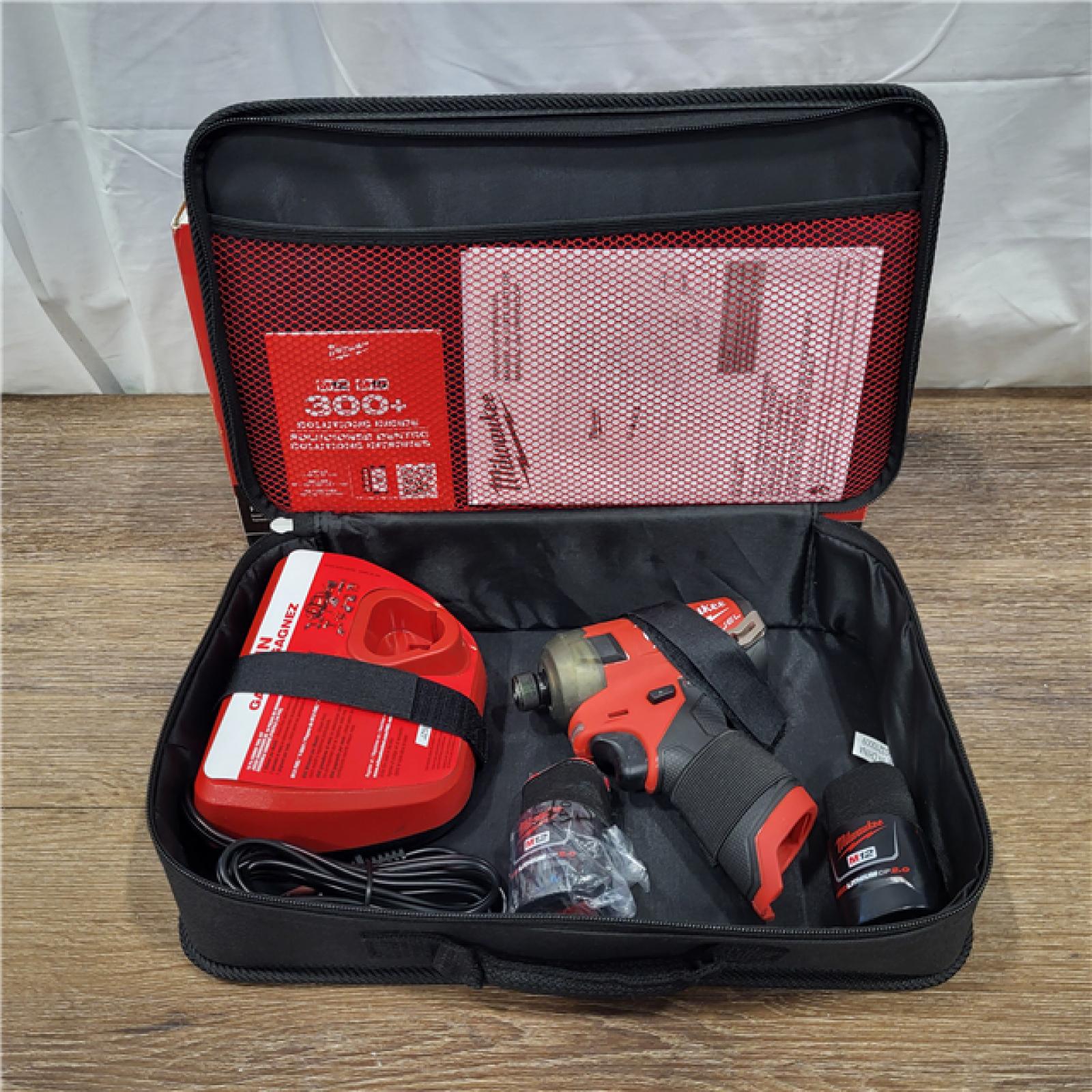 AS-IS M12 FUEL SURGE 12V Lithium-Ion Brushless Cordless 1/4 in. Hex Impact Driver Compact Kit W/Two 2.0Ah Batteries, Bag