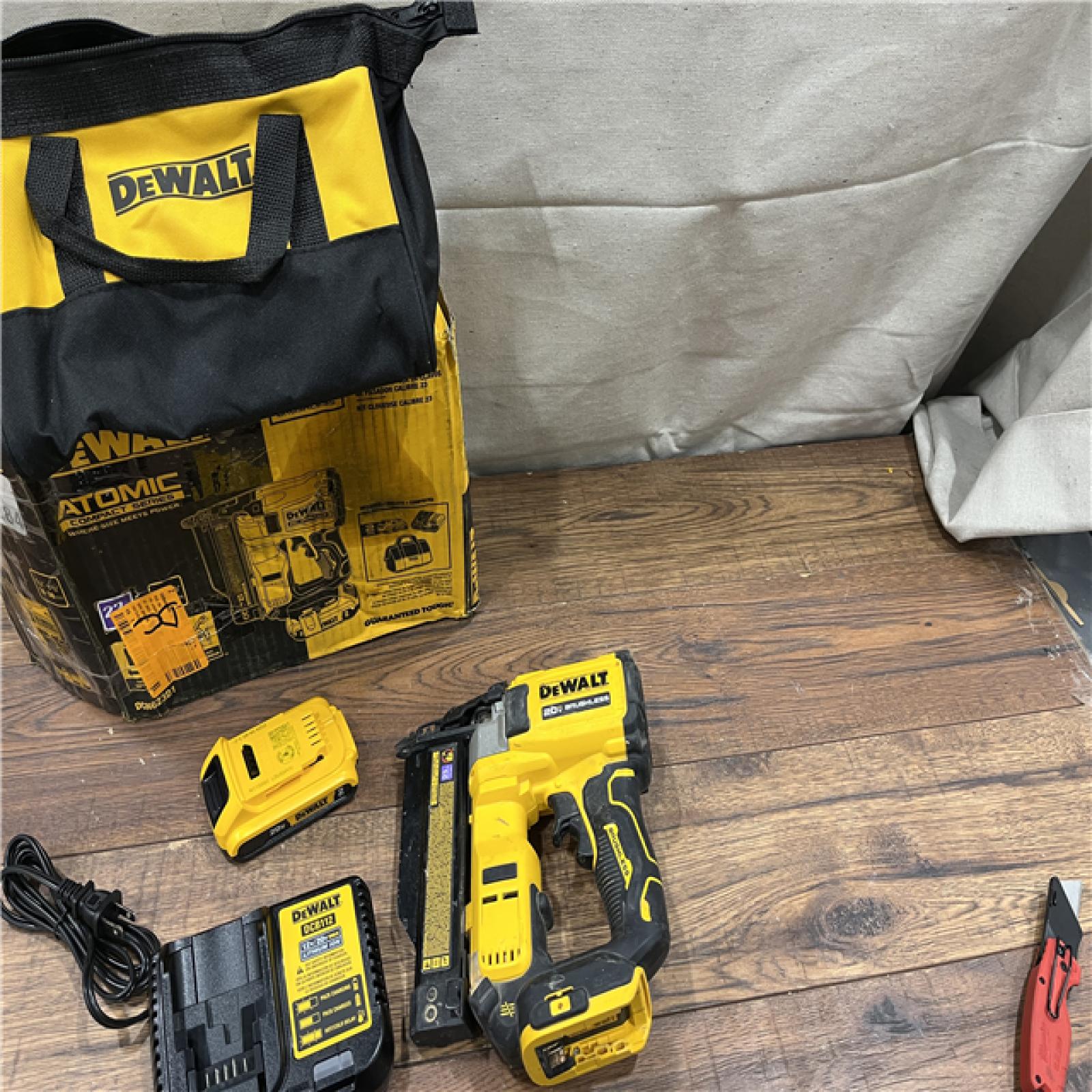 AS-IS DeWalt DCN623D1 20-Volt MAX Atomic Compact Cordless Pin Nailer Kit  Brushless Motor  23 Gauge  Battery - Quantity 1