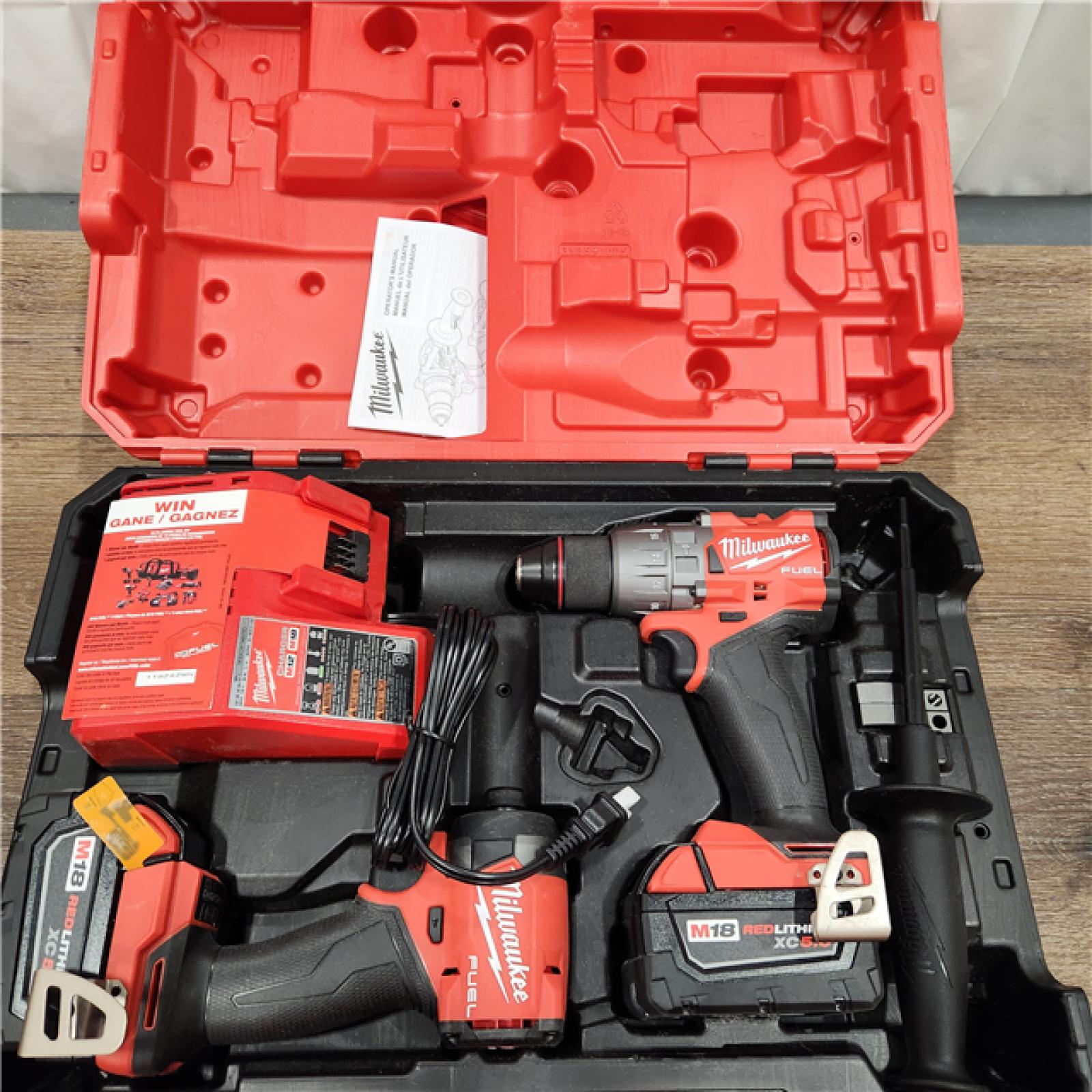 AS-IS Milwaukee M18 FUEL 18V Lithium-Ion Brushless Cordless Hammer Drill and Impact Driver Combo Kit (2-Tool) with 2 Batteries