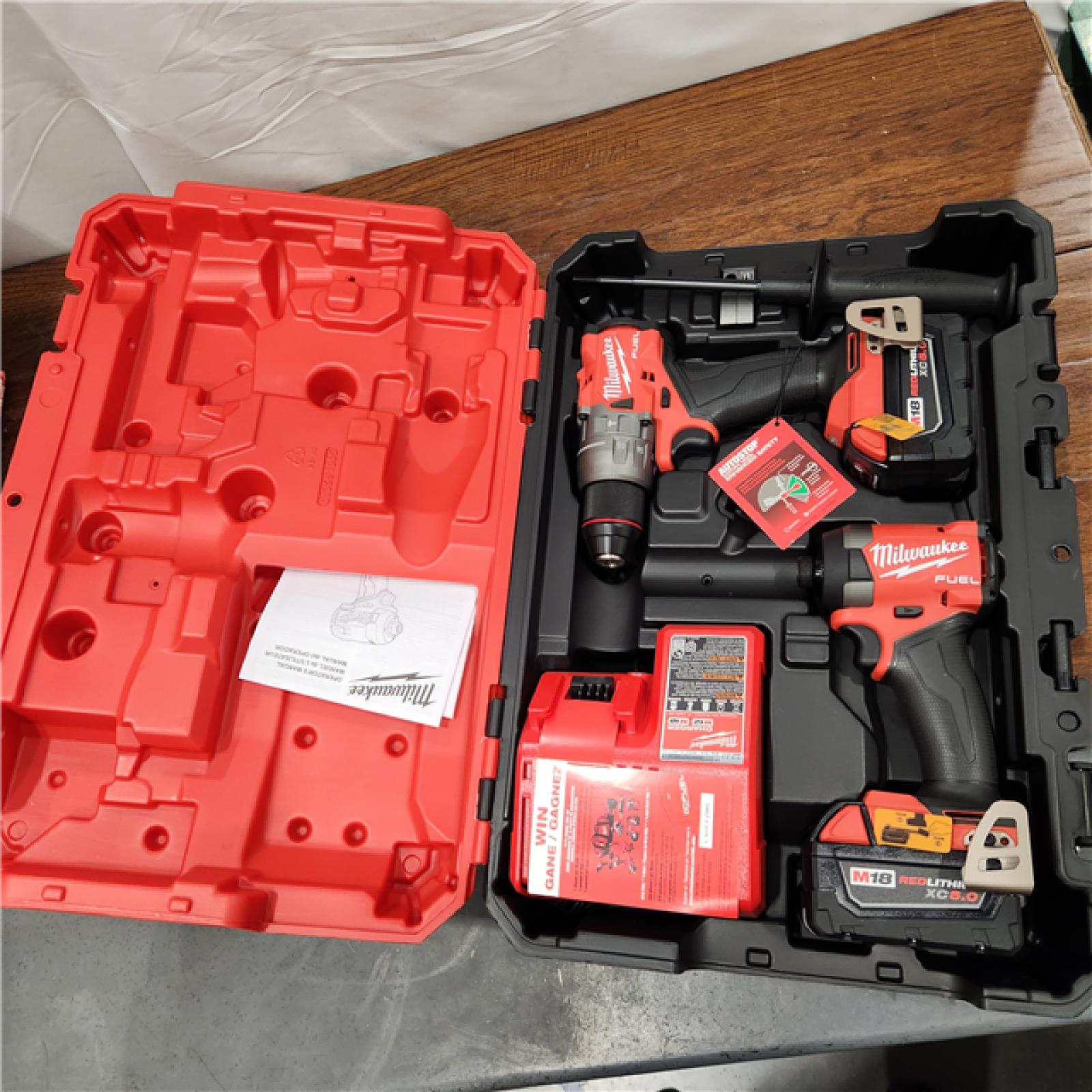 AS-IS Milwaukee M18 FUEL 18V Lithium-Ion Brushless Cordless Hammer Drill and Impact Driver Combo Kit (2-Tool) with 2 Batteries