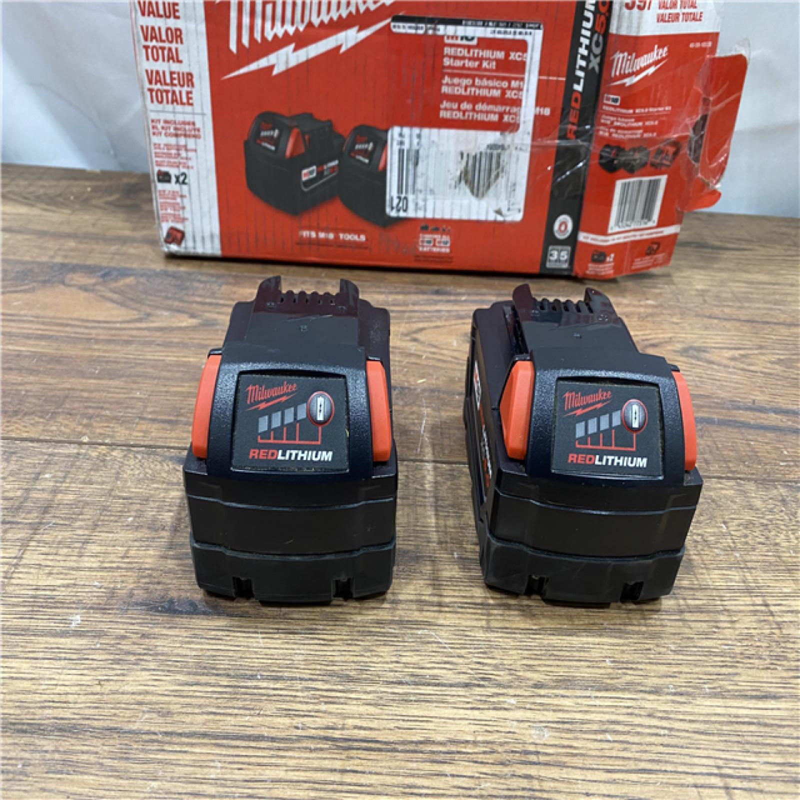 AS IS Milwaukee M18 18-Volt Lithium-Ion XC Starter Kit with Two 5.0Ah Batteries / Charger (48-59-1852B)