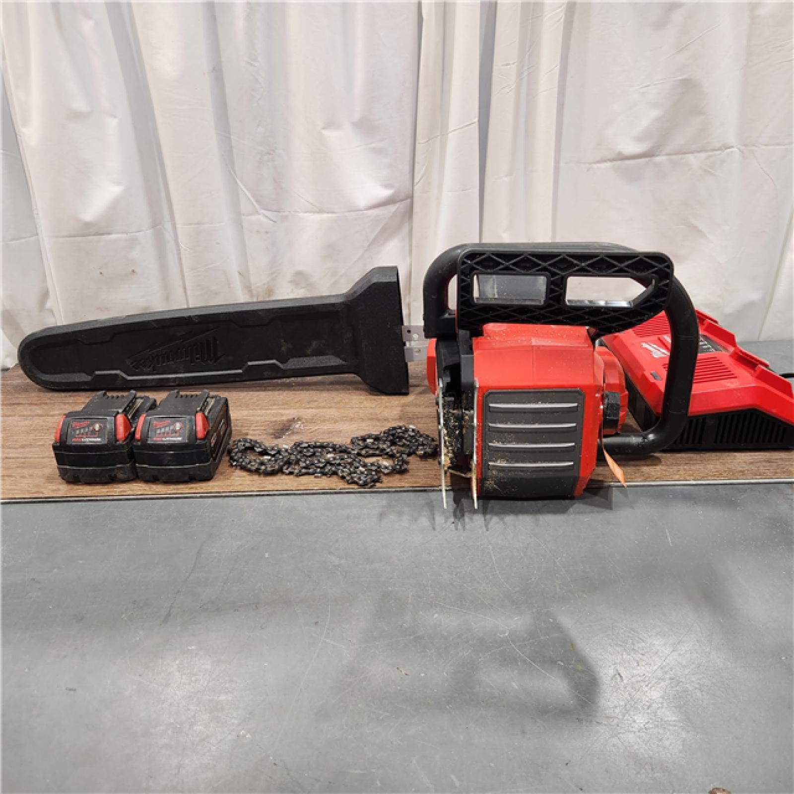 AS IS Milwaukee M18 FUEL Cordless 20 in. Chainsaw Kit