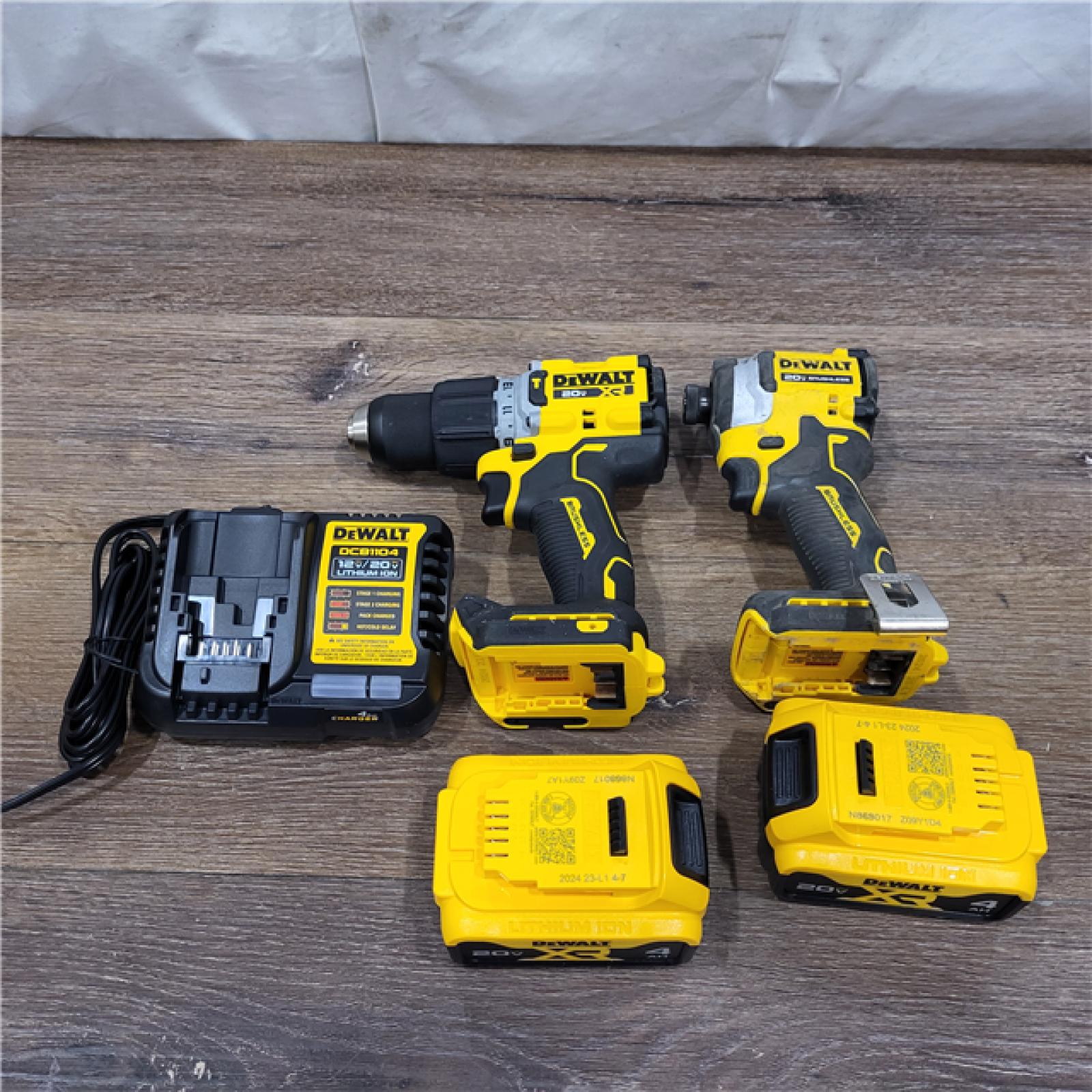 AS-IS DEWALT 20V MAX XR Hammer Drill and ATOMIC Impact Driver 2 Tool Cordless Combo Kit with (2) 4.0Ah Batteries, Charger, and Bag